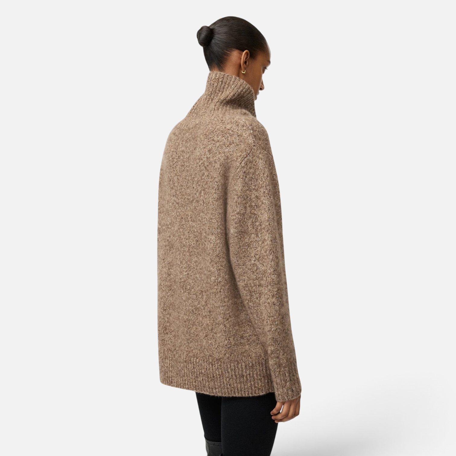 Model wearing a Shop Rescue Spa marled brown cashmere and silk turtleneck sweater with a relaxed fit