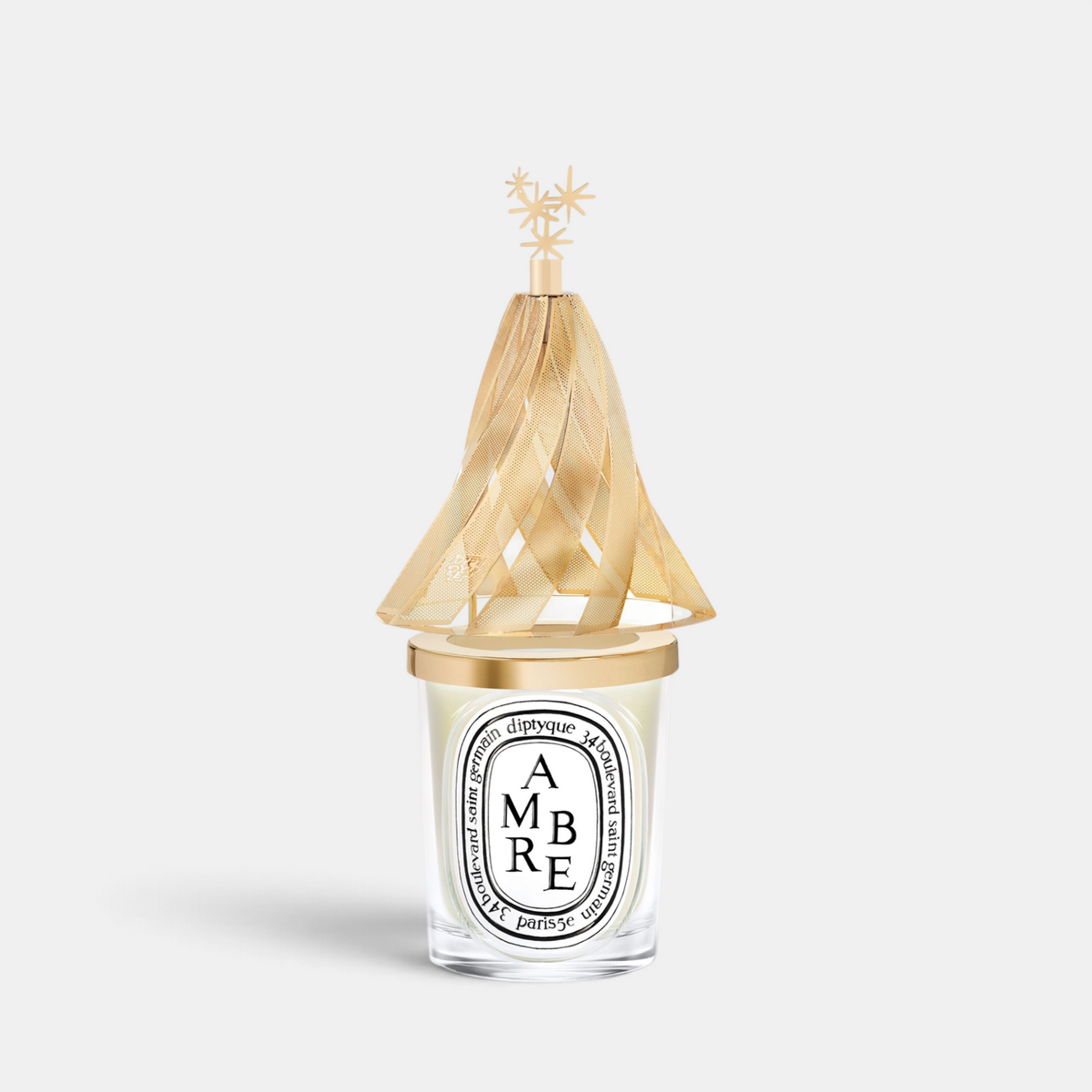 Shop Rescue Spa Diptyque holiday lantern featuring a gold pine tree silhouette with star accents for a 190g candle