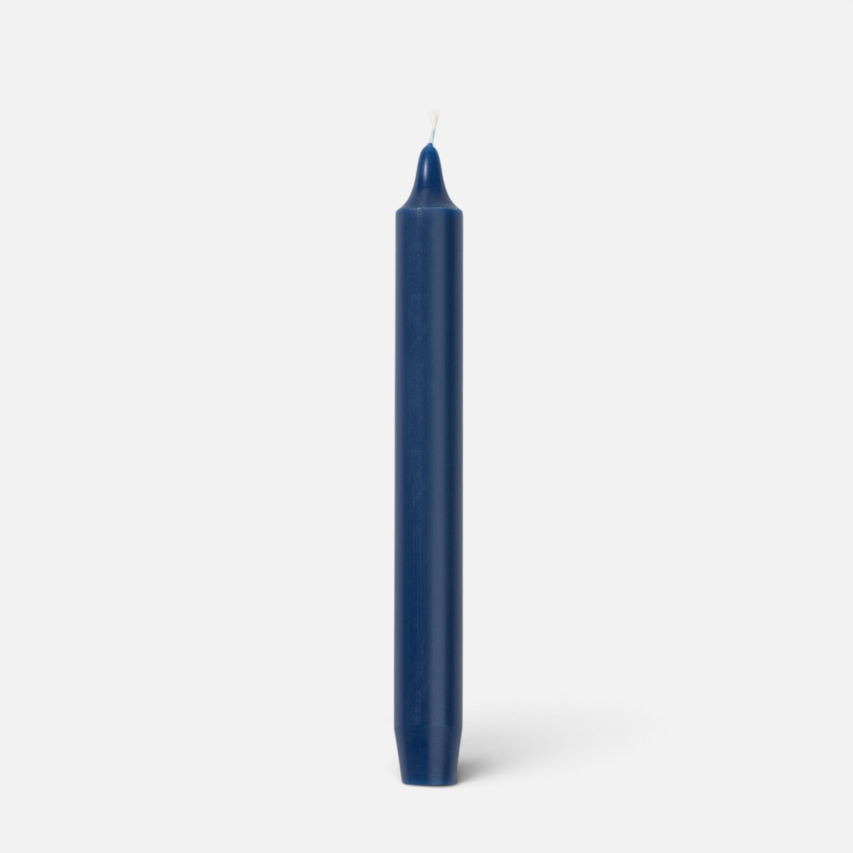 Shop Rescue Spa Madeleine taper candle in dark blue wax, a dripless and smokeless 8-inch candle for home decor.
