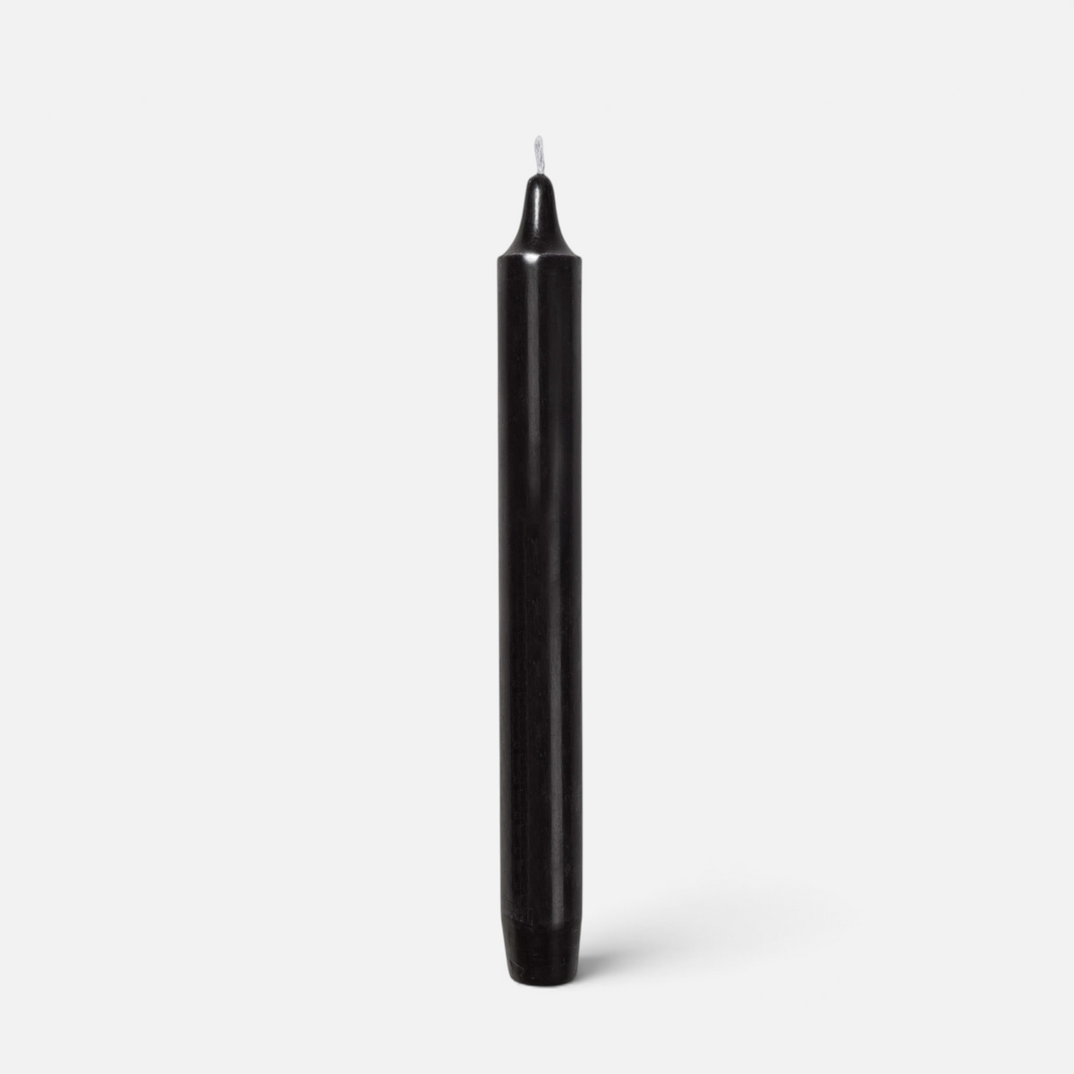 Shop Rescue Spa Madeleine black taper candle made from high-quality wax with a smokeless and dripless design.