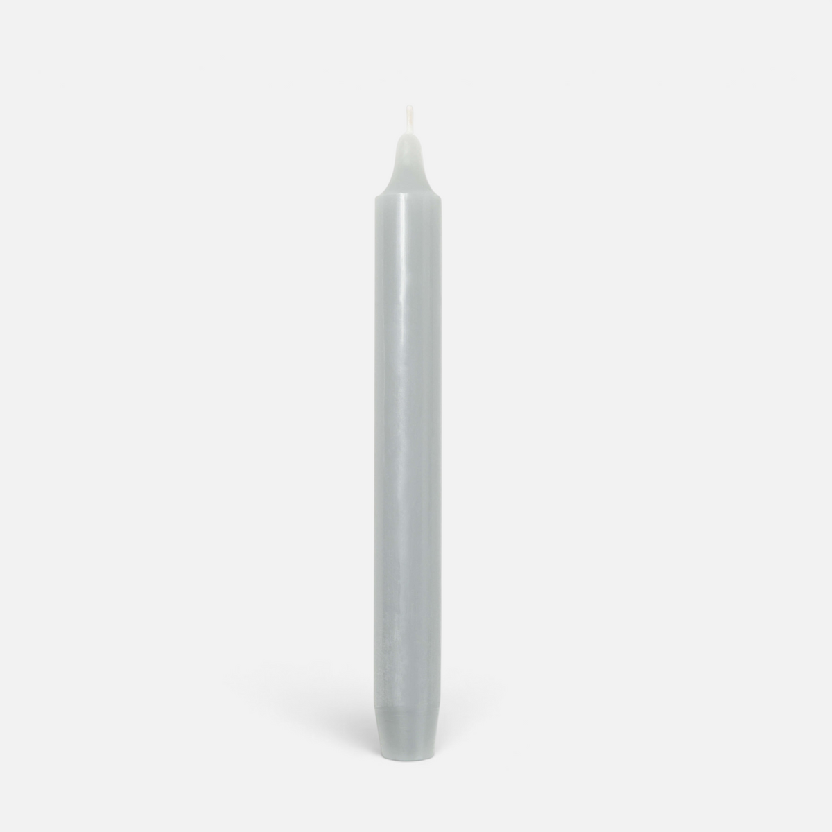 Shop Rescue Spa Madeleine taper candle in a smooth grey wax finish, standing vertically against a plain background.