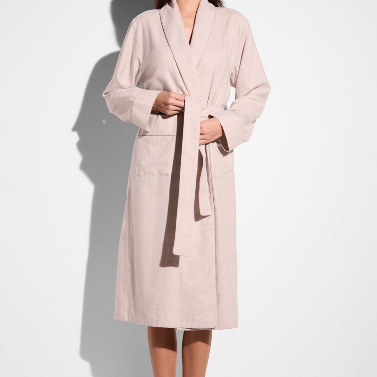 Shop Rescue Spa long pink flannel robe with shawl collar, belt tie, and front pockets on a model
