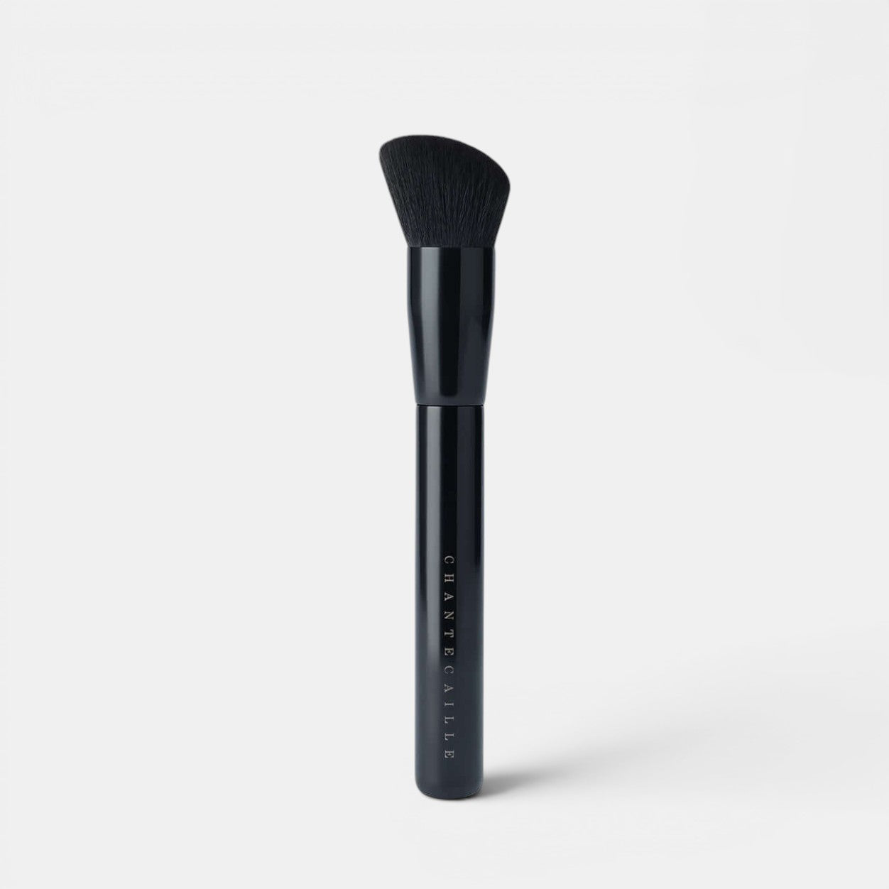 Chantecaille Blend and Smooth brush positioned upright with a white background. Perfect for blending liquid, powder and gel formulas seamlessly across the skin.