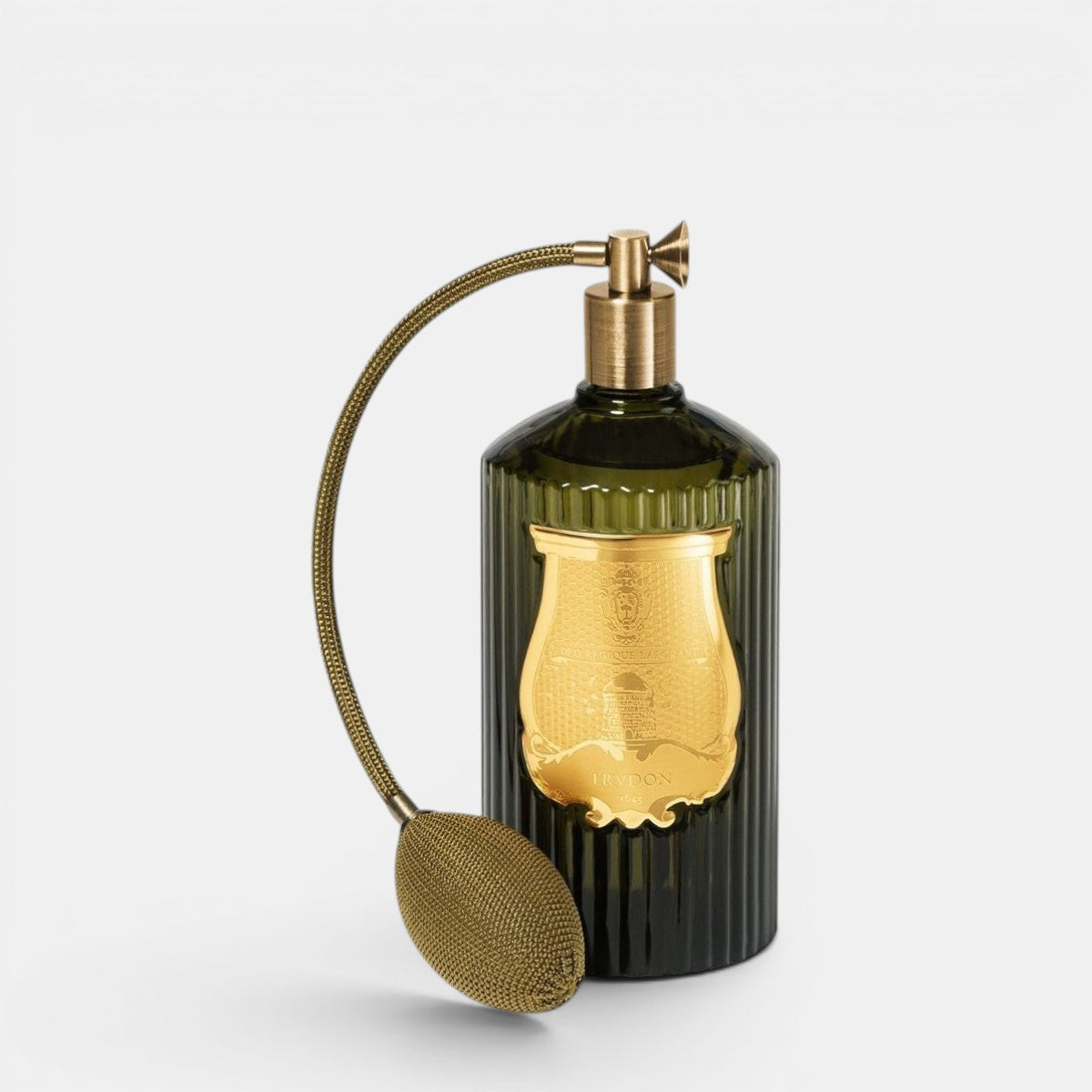 Decorative bottle with gold cap and nozzle on a white background