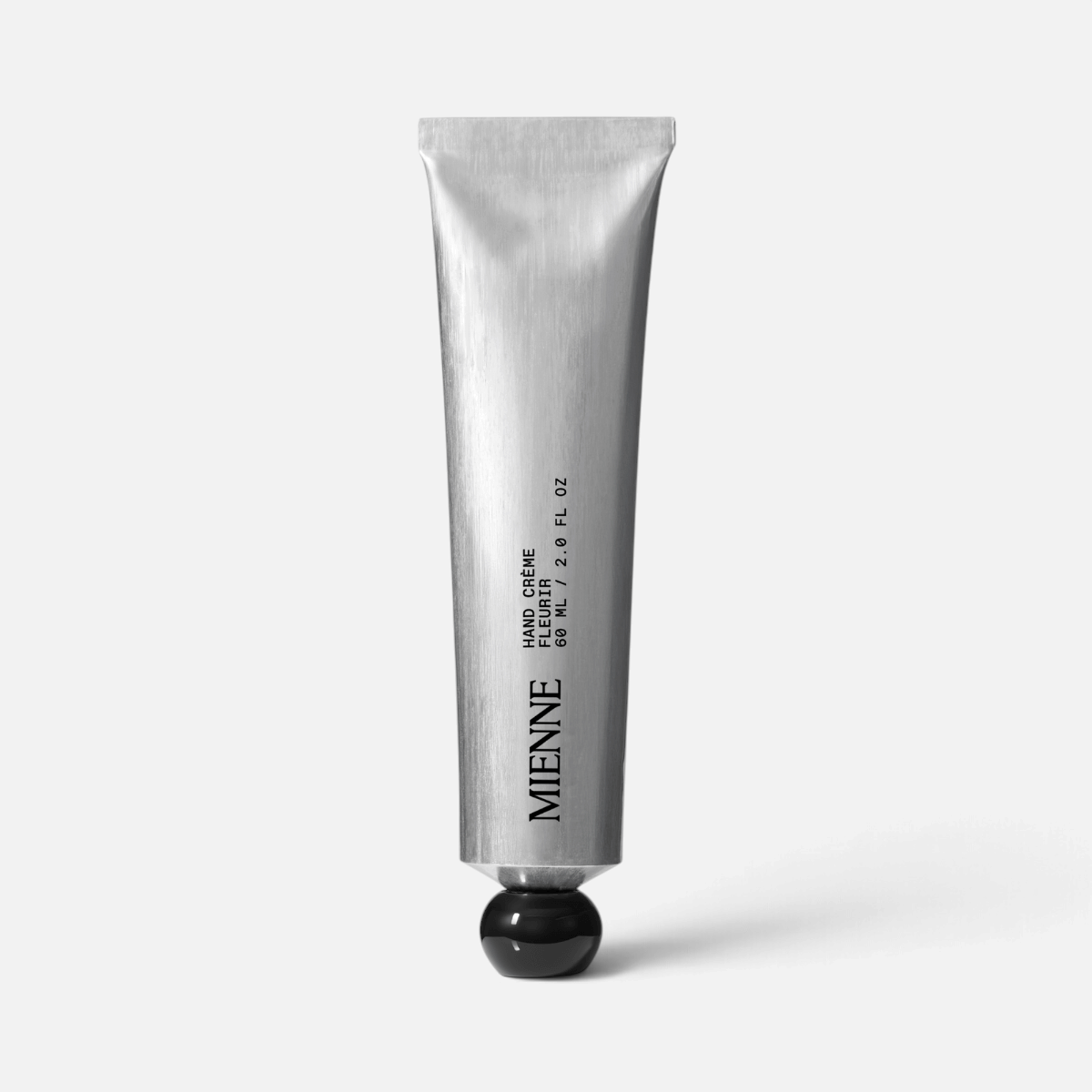 Shop Rescue Spa Mienne Fleurir hand crème in a sleek silver 60ml metal tube with a black cap.
