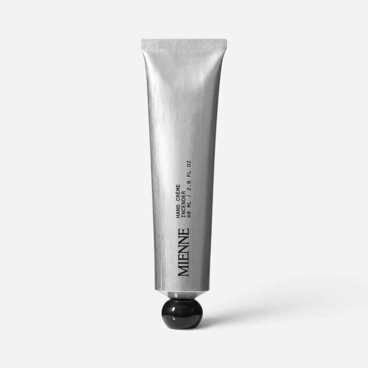 Shop Rescue Spa Mienne Hand Creme in Incendier scent, a 60ml silver metal tube with a black cap.