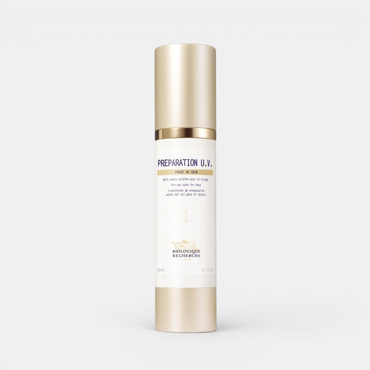Préparation U.V. – white and gold skincare bottle with a gold pump cap, displayed on a white background.