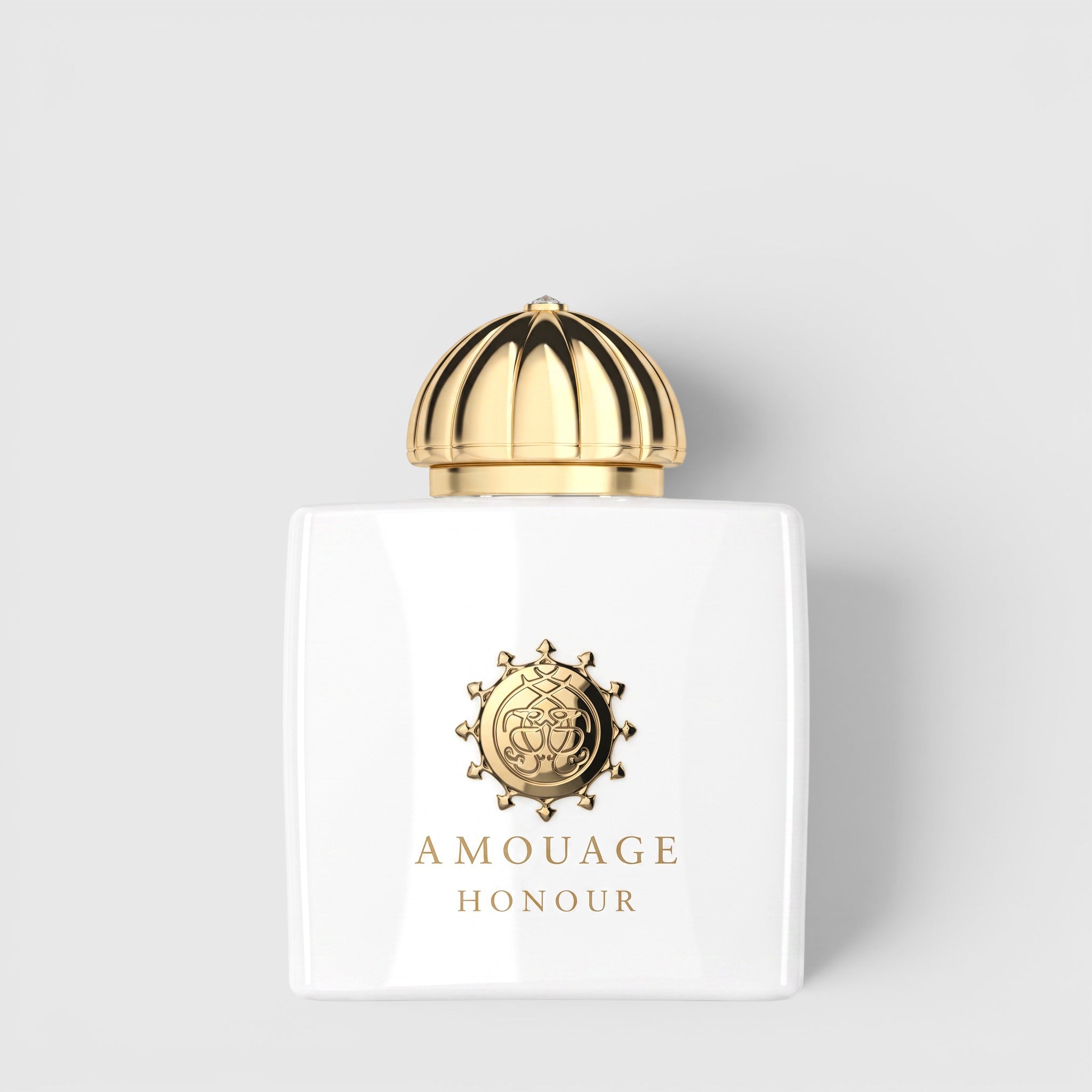 Shop Rescue Spa Amage Honour Eau De Parfum in a white glass bottle with a gold dome cap and embossed gold logo.