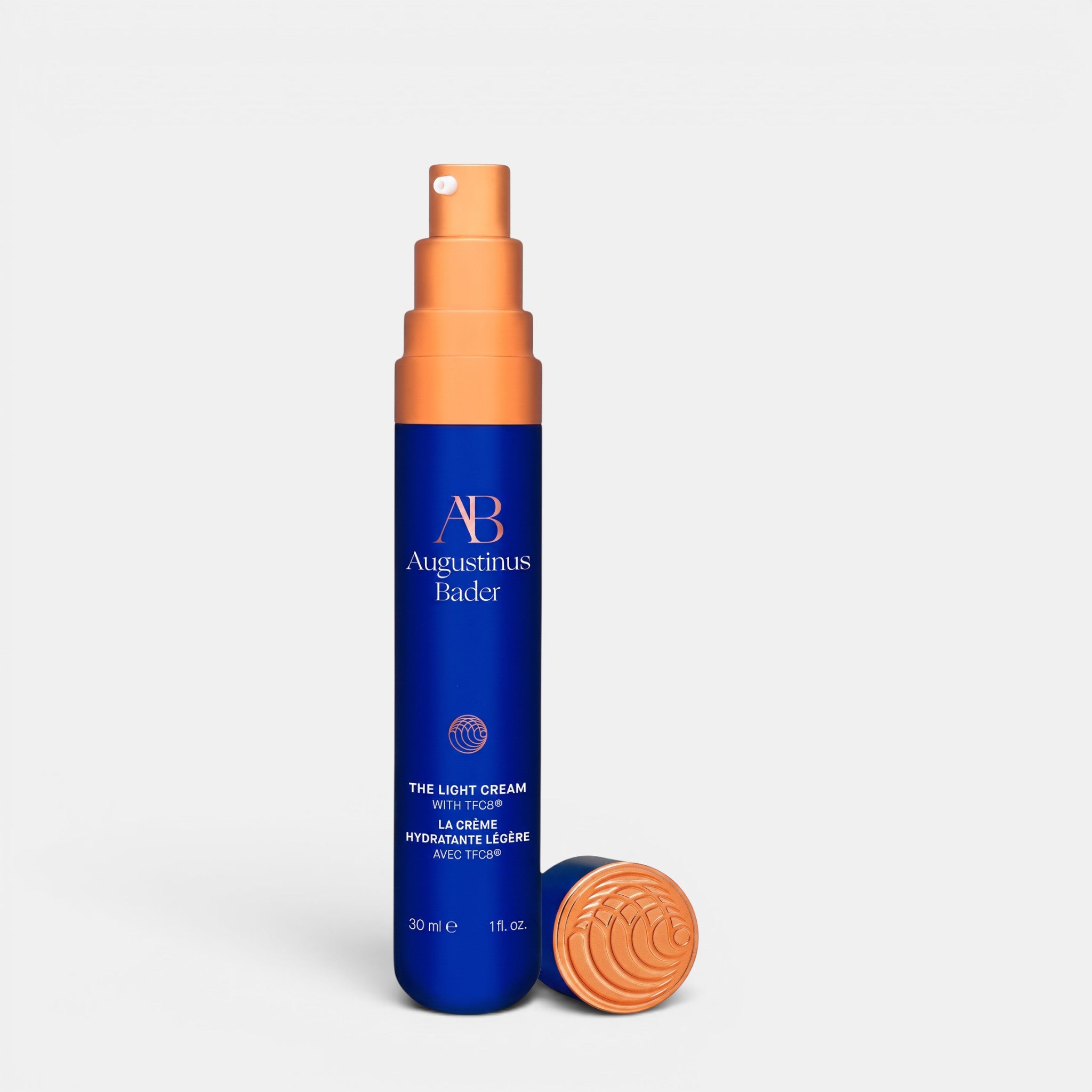 Shop Rescue Spa Augustinus Bader The Light Cream 30ml in a blue bottle with a copper pump and cap.