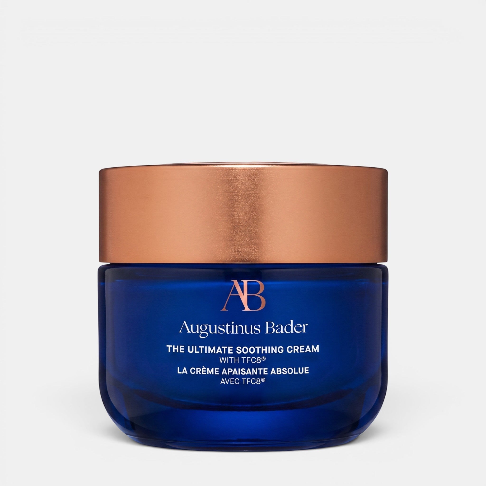 Shop Rescue Spa Augustinus Bader The Ultimate Soothing Cream in a blue glass jar with a metallic bronze lid.