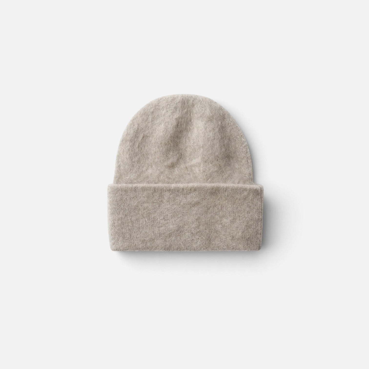 Shop Rescue Spa brushed beige cashmere beanie with a folded cuff in a soft knit texture