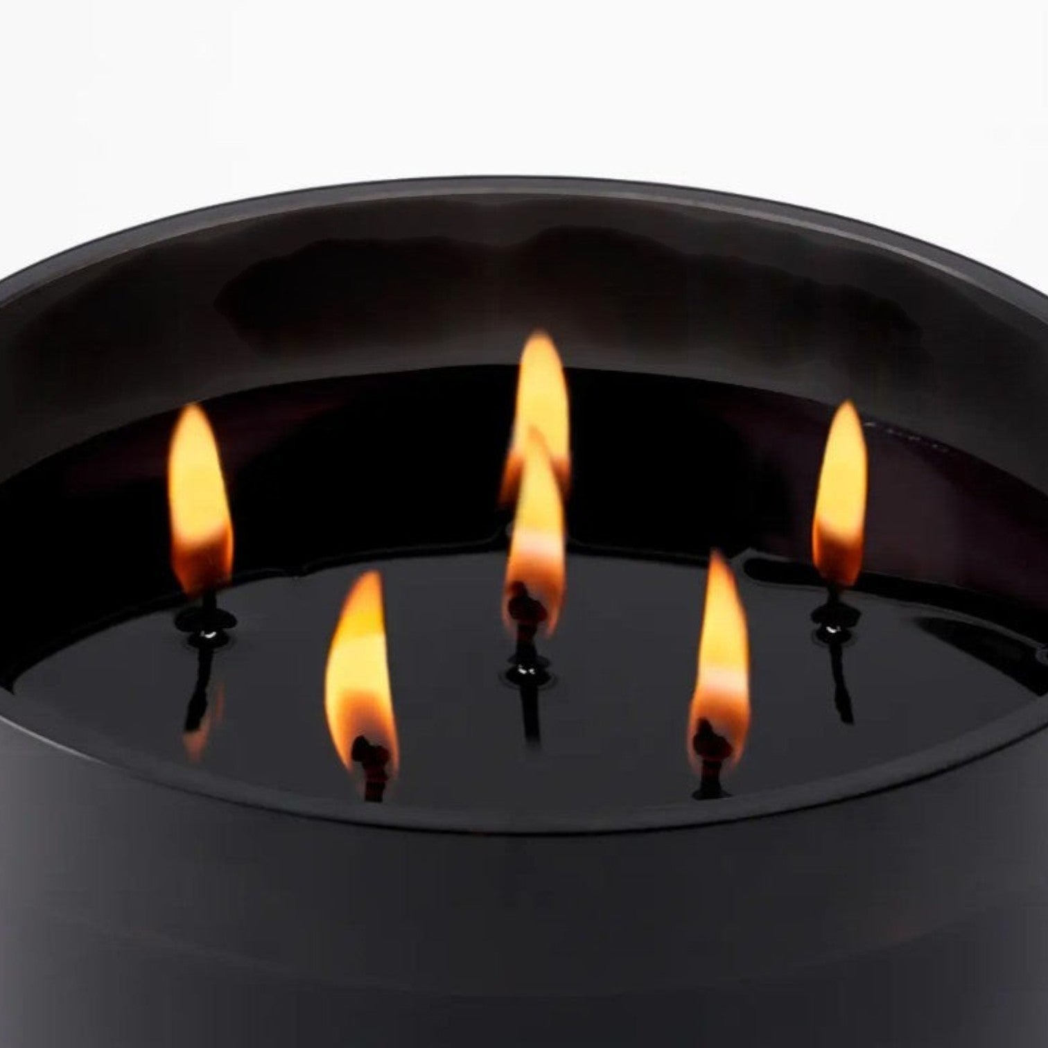 Shop Rescue Spa Bibliotheque candle with five flames burning in dark wax, notes of peach, plum, vanilla, and patchouli.
