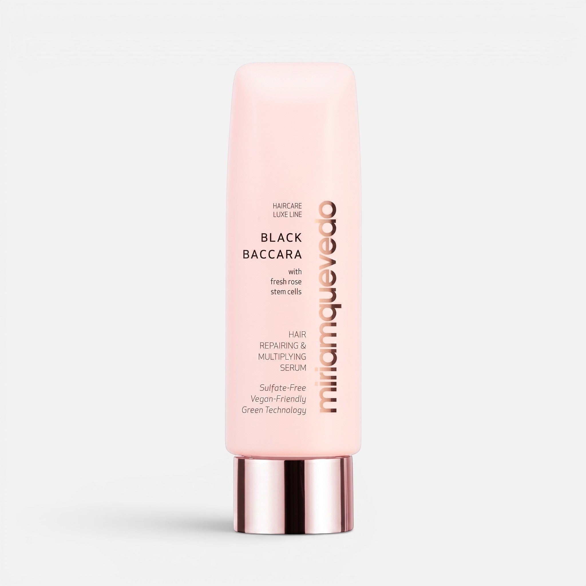 Shop Rescue Spa Black Baccara hair repairing and multiplying serum in a light pink squeeze tube with metallic cap.