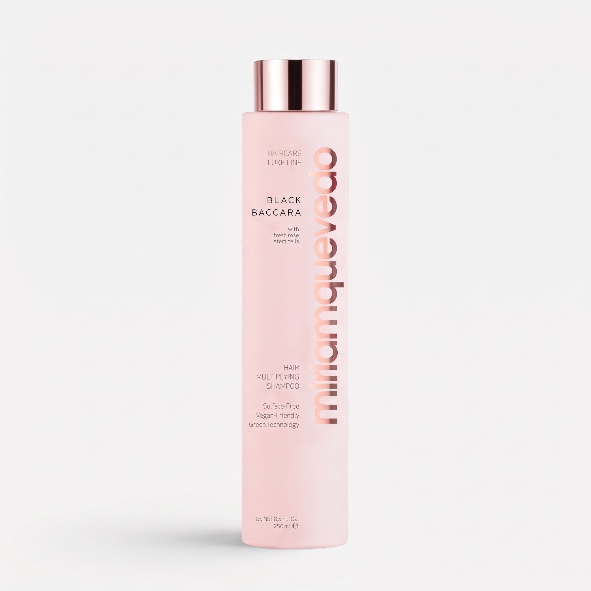 Shop Rescue Spa Black Baccara Hair Multiplying Shampoo in a tall, pale pink bottle with a metallic rose gold cap.