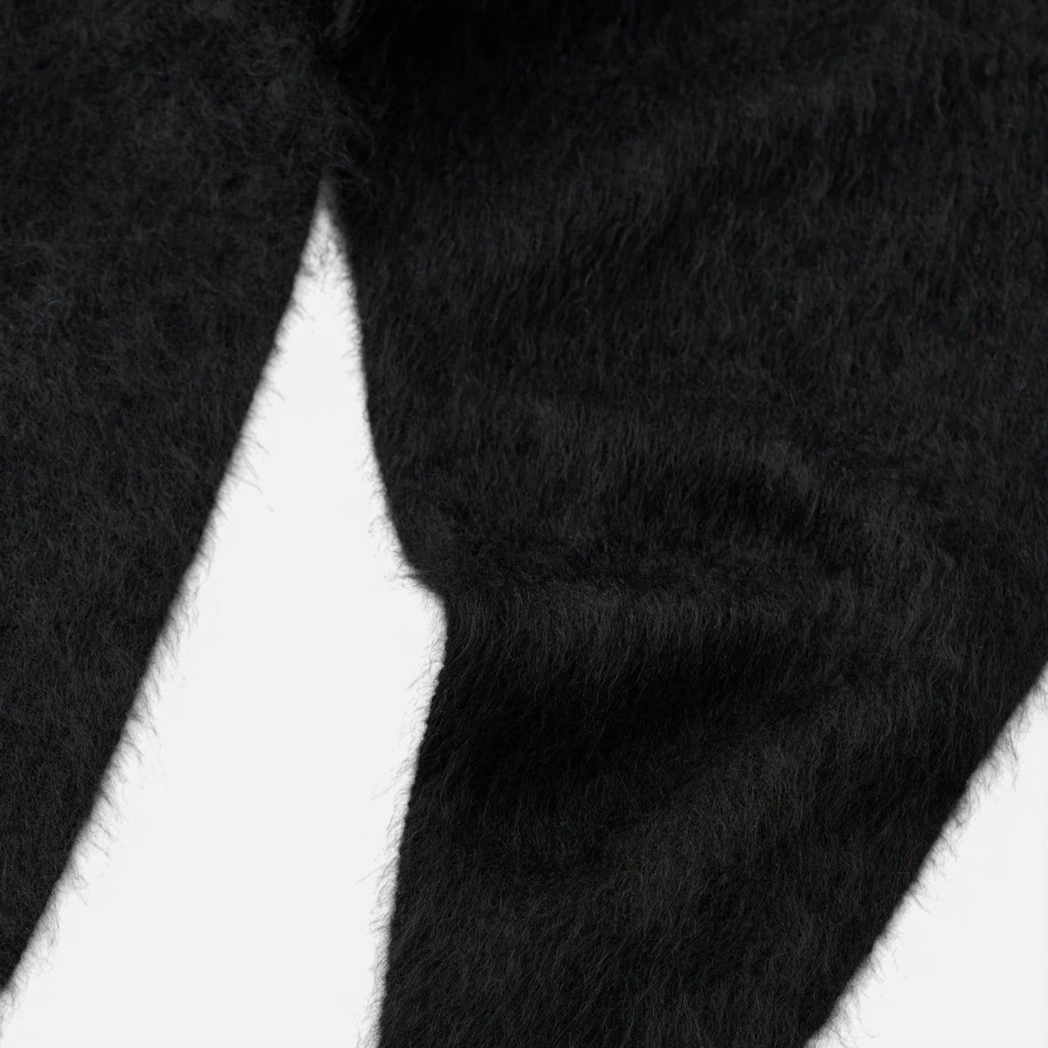 Shop Rescue Spa black brushed cashmere scarf with a soft, fuzzy knit texture