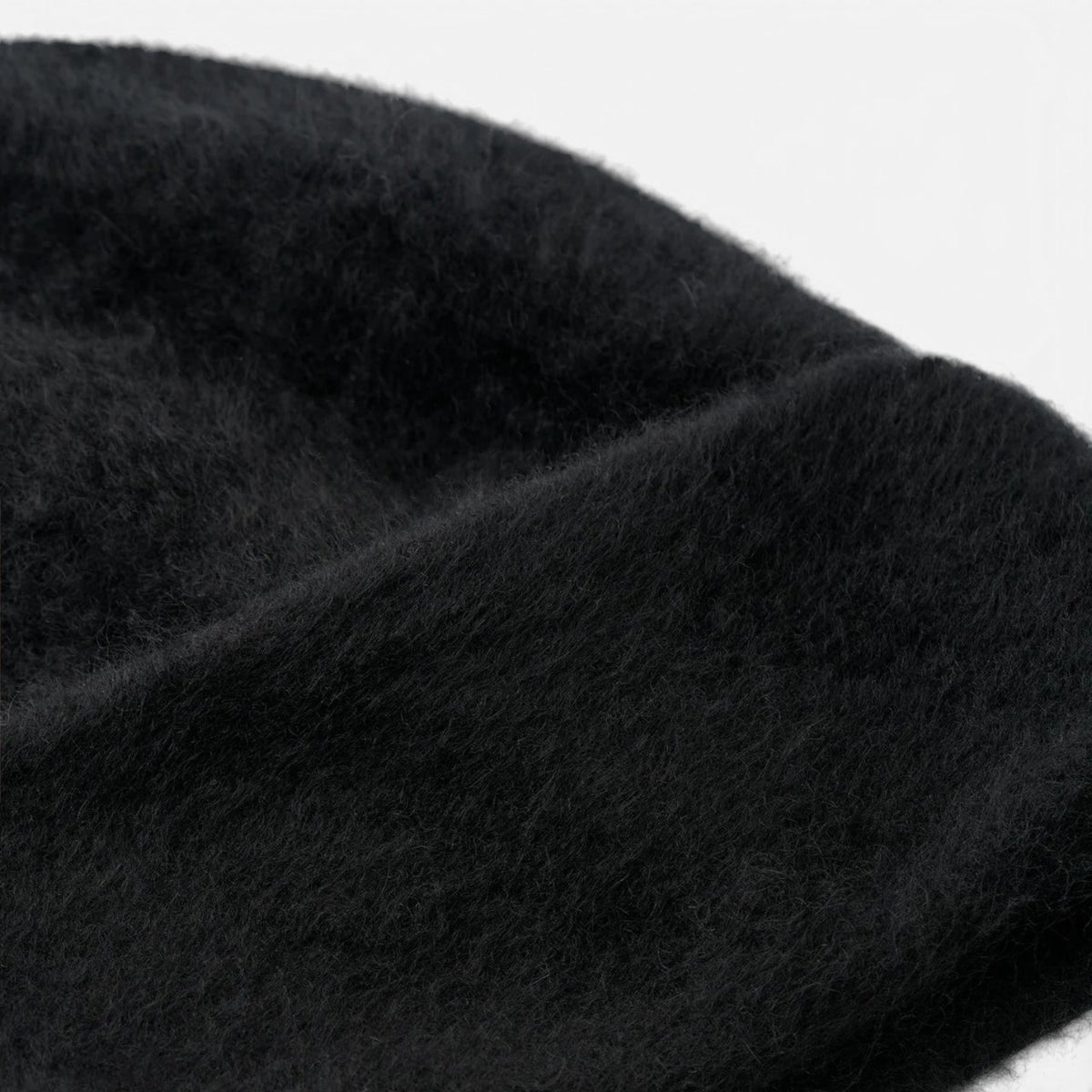 Shop Rescue Spa black brushed 100% cashmere knit beanie with a soft, fuzzy texture.