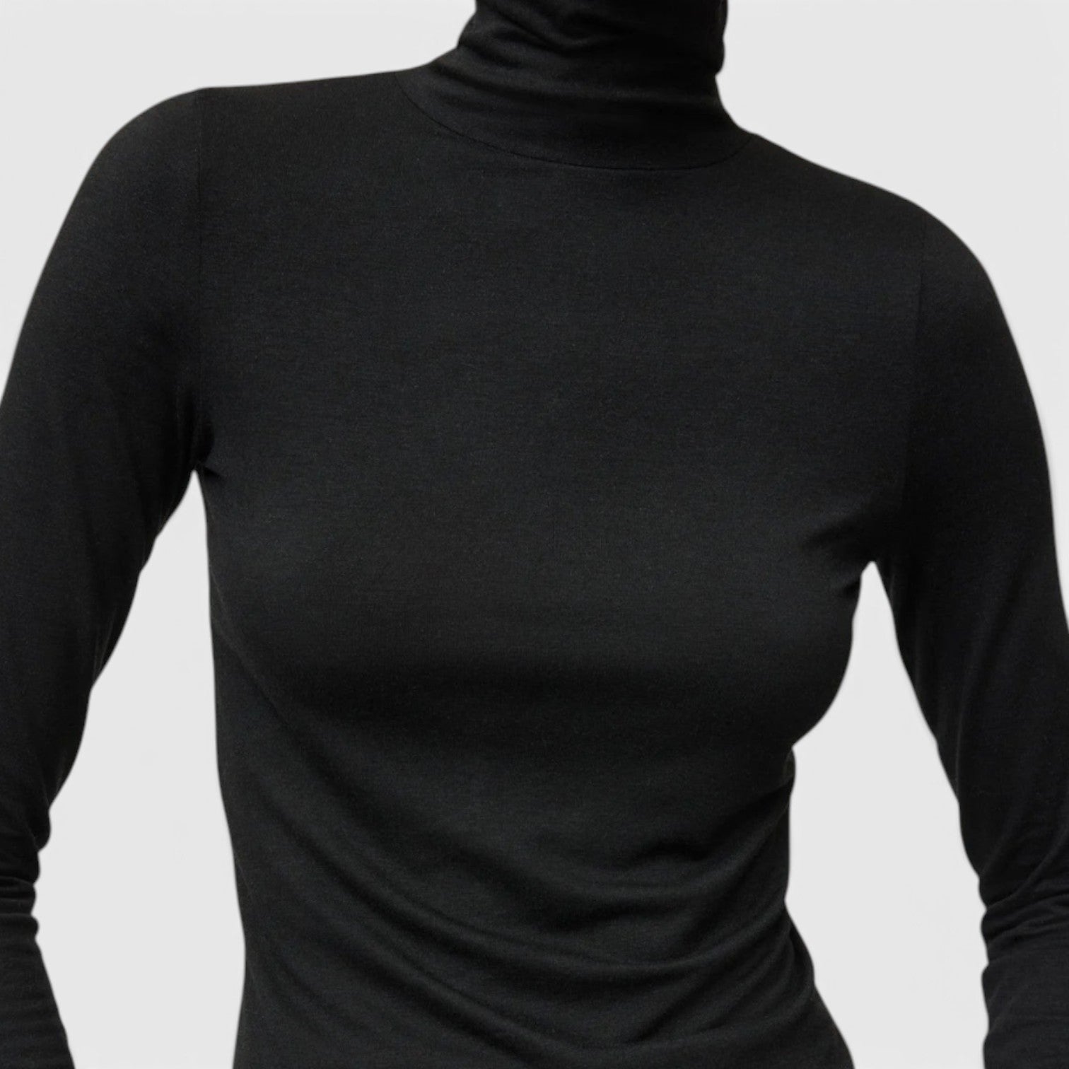 Shop Rescue Spa lightweight black jersey turtleneck made from a soft Tencel and cashmere blend.