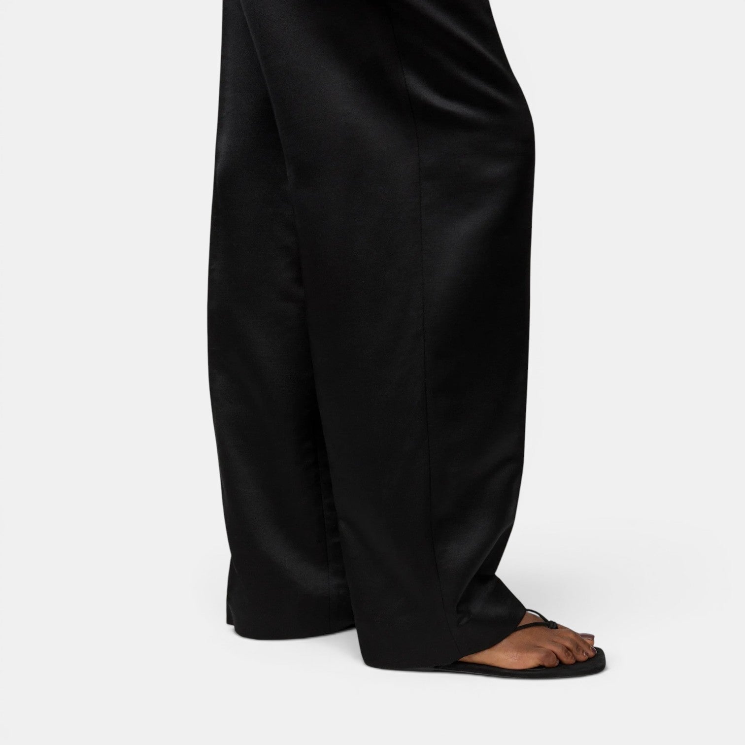 Shop Rescue Spa black woven silk and wool blend straight fit pants with elastic waist.