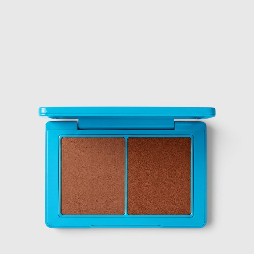 Shop Rescue Spa Sun Tone Bronzing Crème duo in a bright blue compact with two complementary tan bronzer shades.