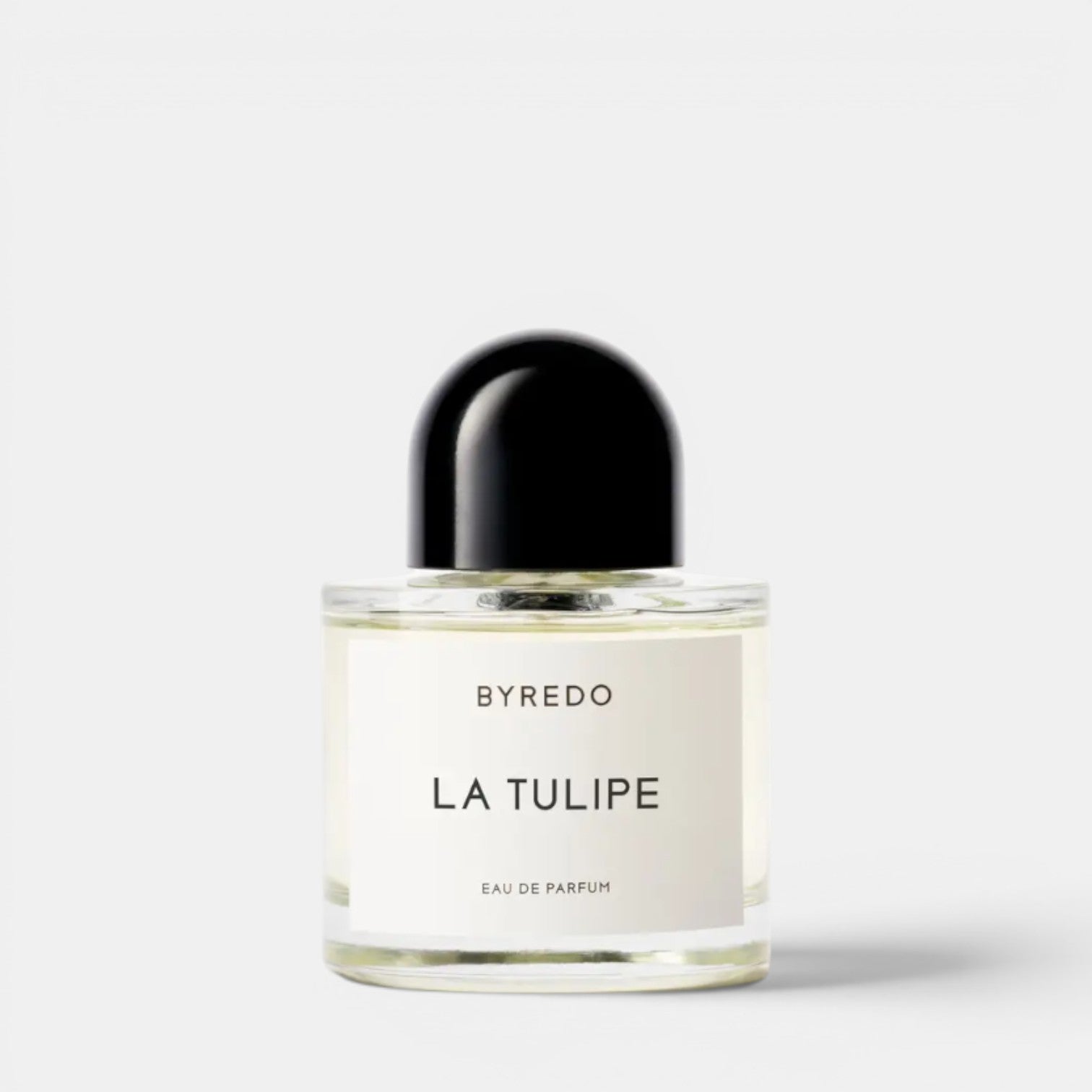 Shop Rescue Spa BYREDO La Tulipe Eau De Parfum bottle with a black cap. Notes of cyclamen, freesia, rhubarb, tulip, blonde woods, vetiver.