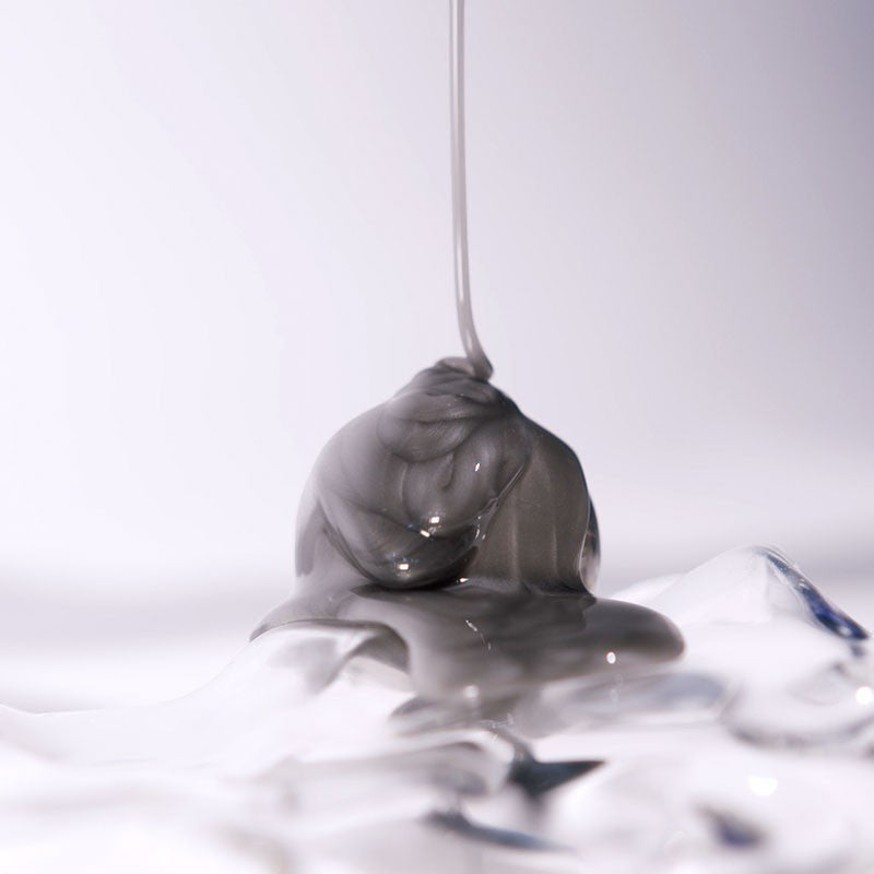 Shop Rescue Spa Extreme Caviar Purifying Charcoal Shampoo with a thick grey charcoal texture dripping
