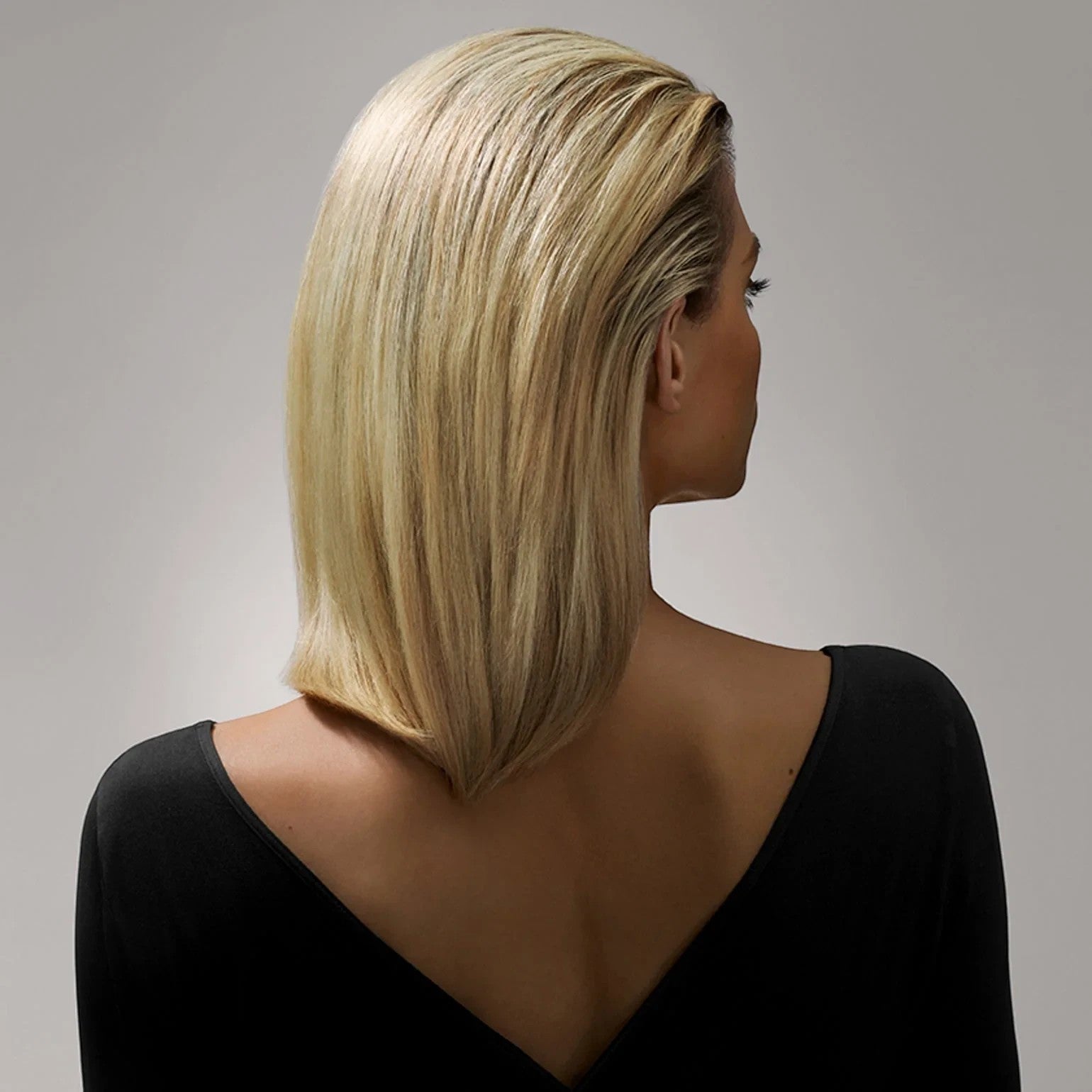 Shop Rescue Spa Creme for Style used on a woman with sleek, shiny blonde hair for a firm yet flexible hold.