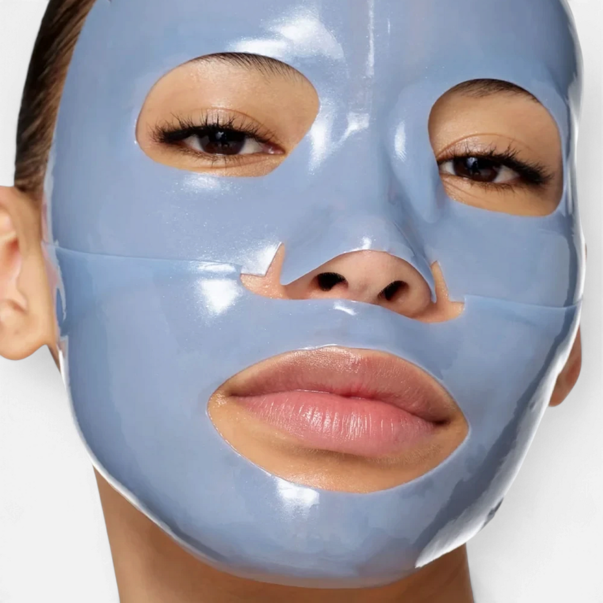 Shop Rescue Spa Sub-Zero De-Puffing Energy hydrogel facial mask in light blue on a woman&