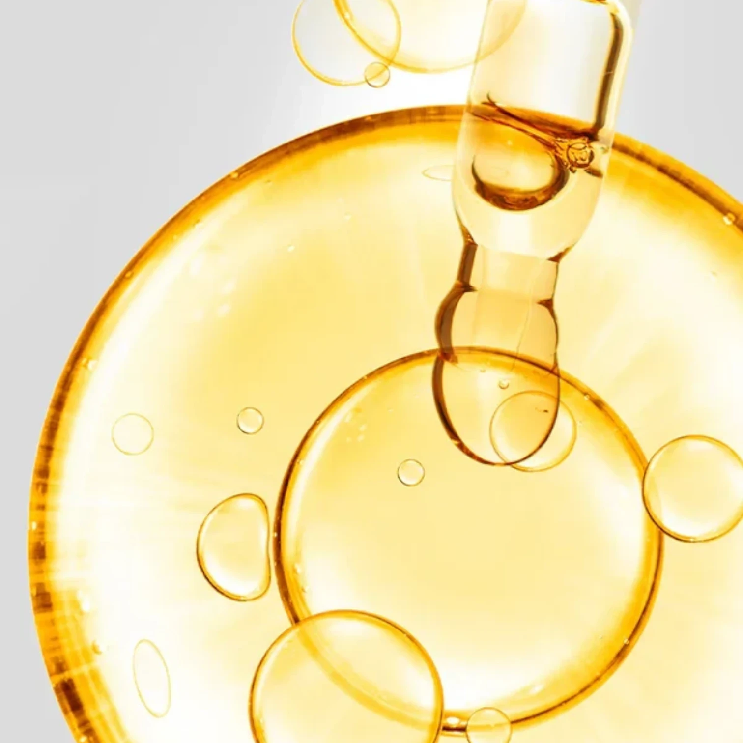 Shop Rescue Spa D7 Serum featuring a golden, vitamin-rich elixir with a dropper, creating a radiant, dewy skin effect.