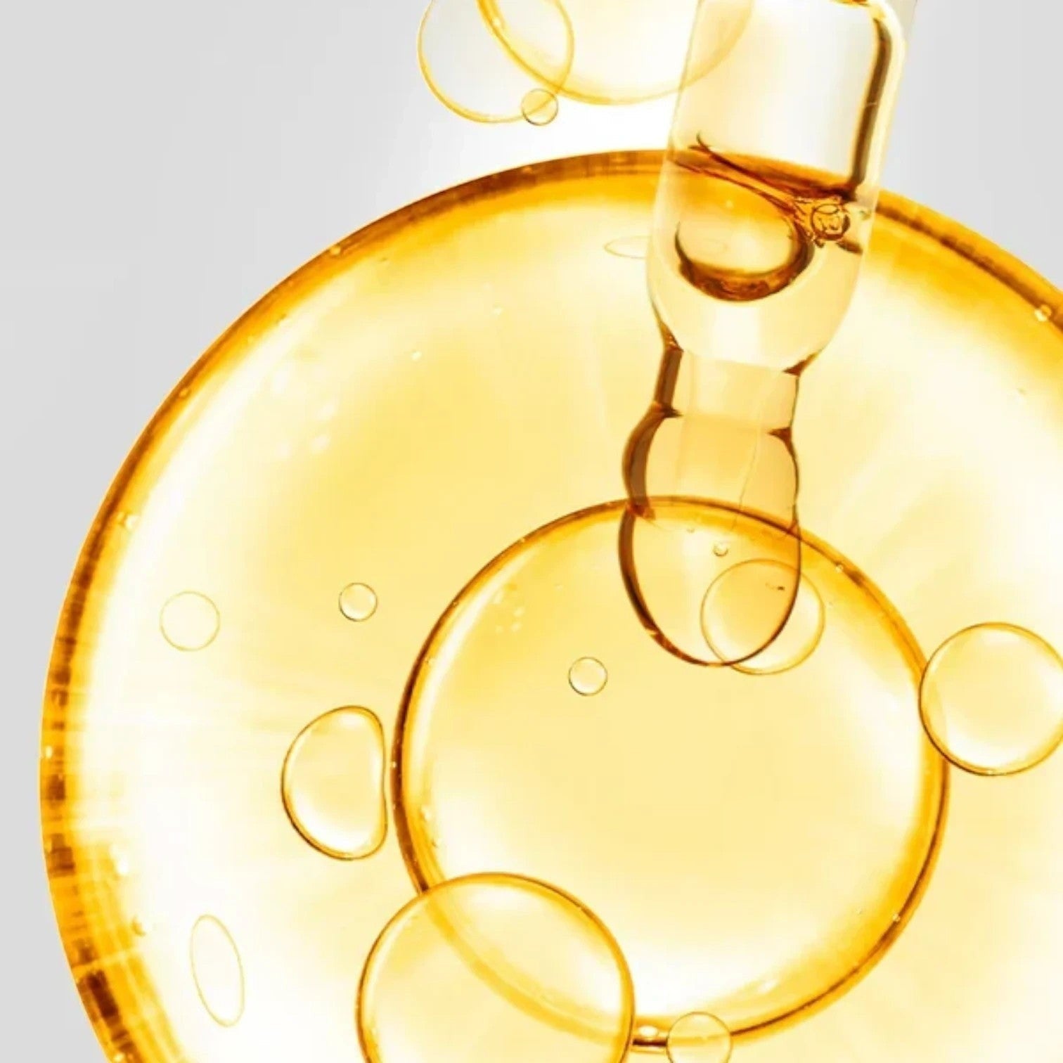 Shop Rescue Spa D7 Serum featuring a golden, vitamin-rich elixir with a dropper, creating a radiant, dewy skin effect.