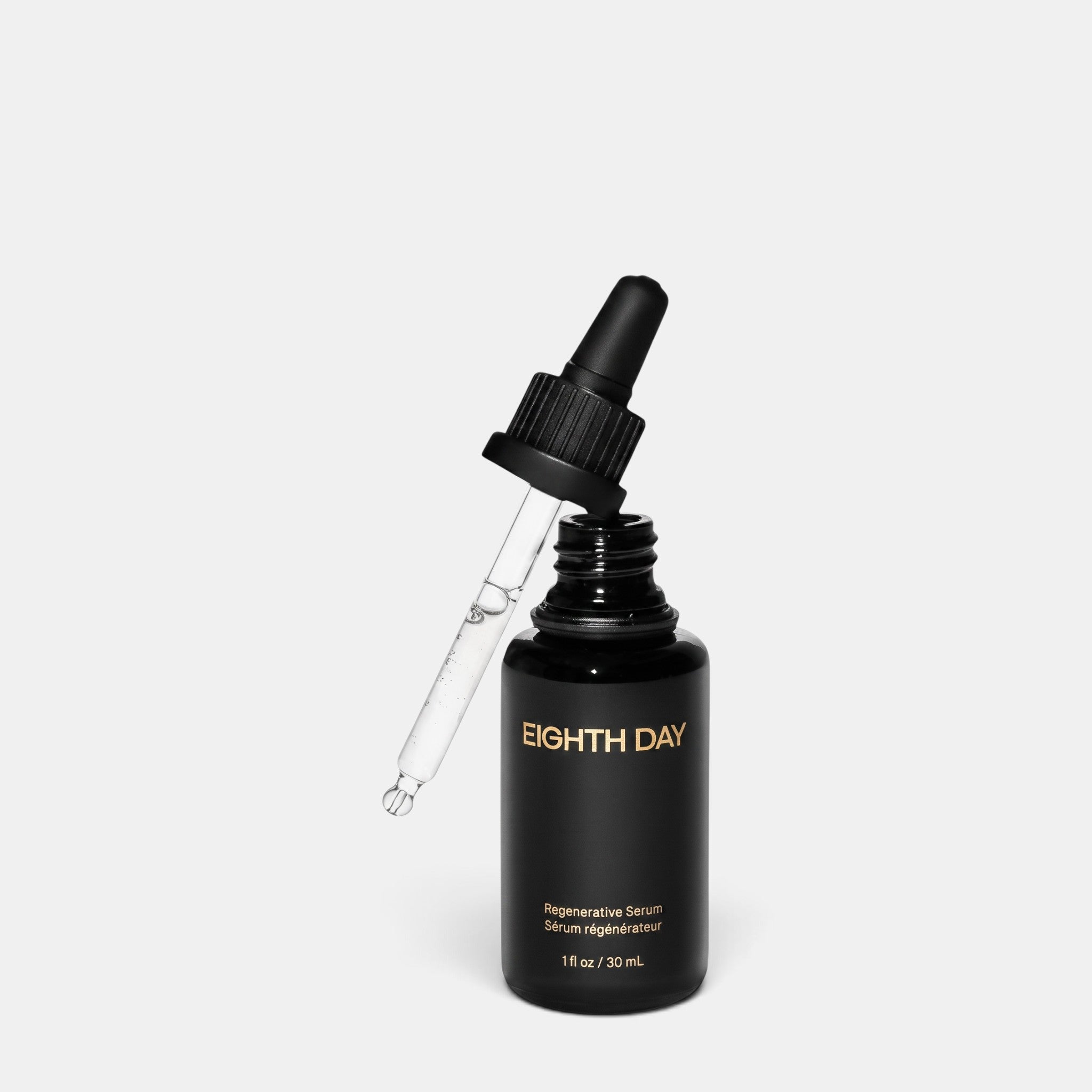 Shop Rescue Spa Eighth Day Regenerative Serum in a black glass bottle with a glass dropper against a white background.