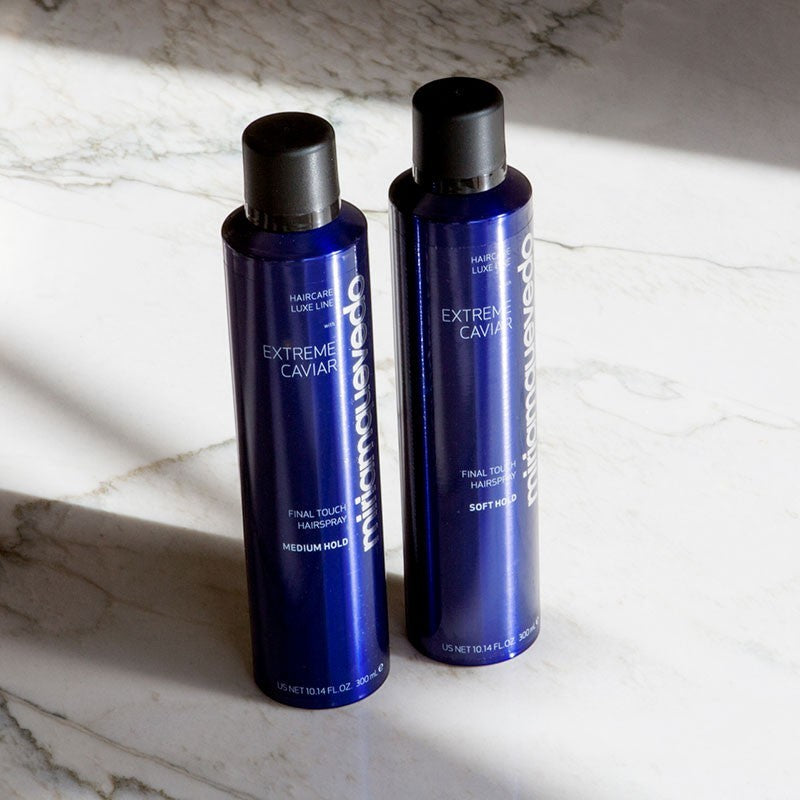 Shop Rescue Spa Extreme Caviar soft hold hairspray bottles in blue packaging on a marble surface.