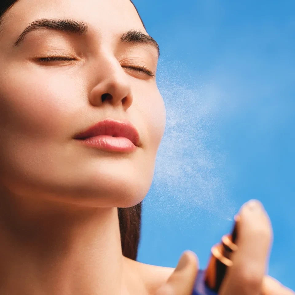 Shop Rescue Spa The Face Mist being sprayed on a woman&