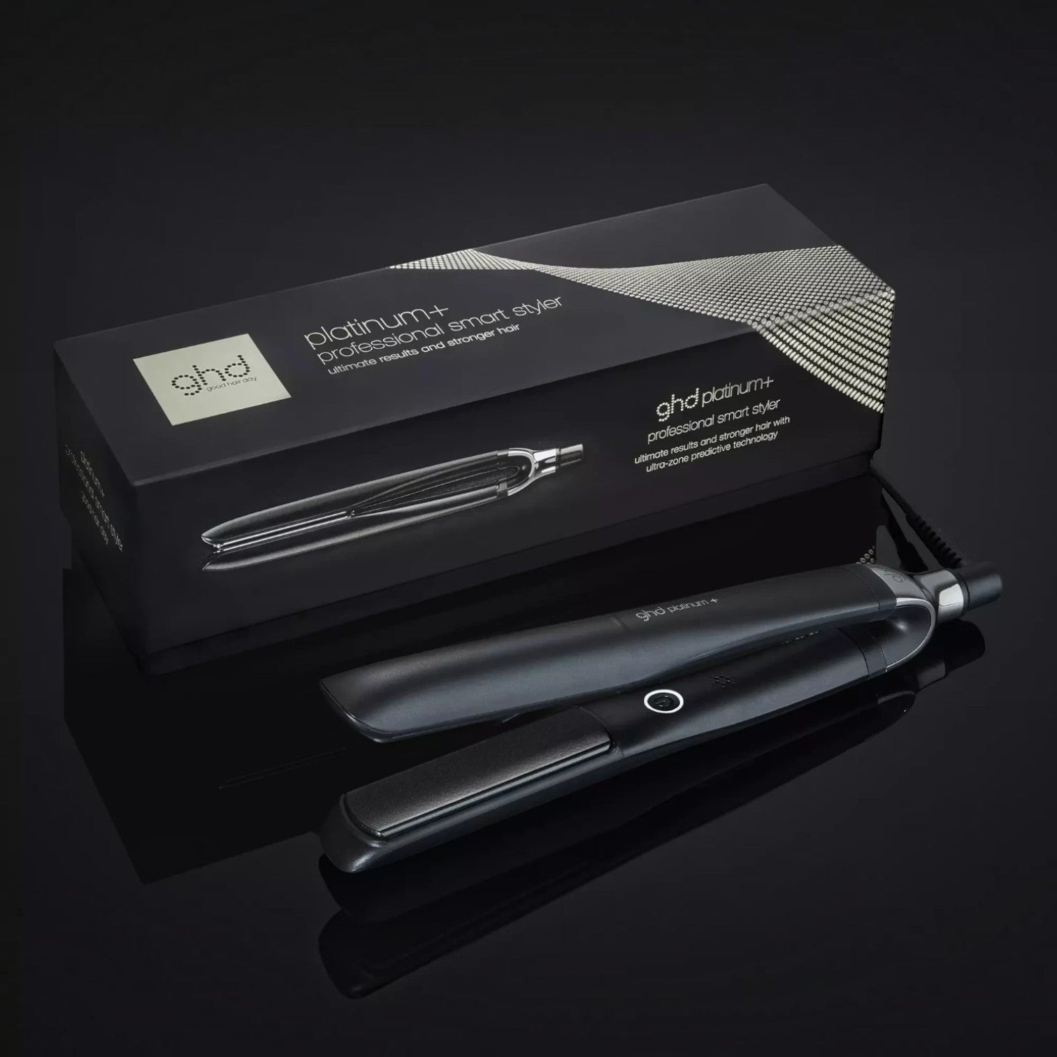 Shop Rescue Spa ghd Platinum+ smart flat iron with its black branded packaging box on a reflective dark surface