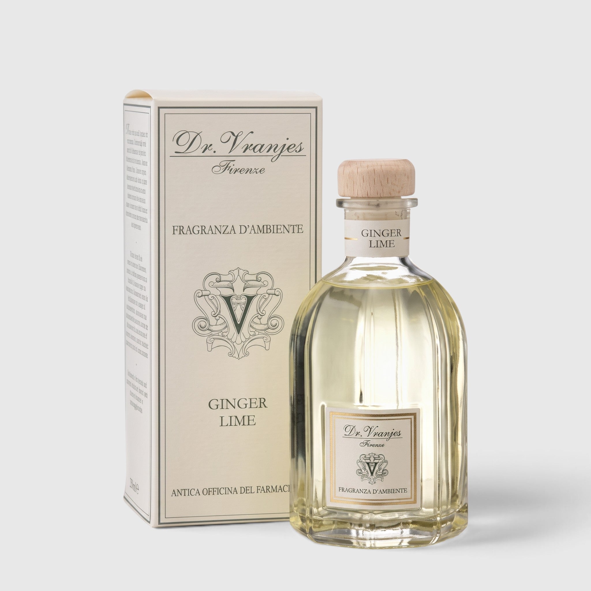 Shop Rescue Spa Ginger Lime room diffuser in a glass bottle with a wooden stopper next to its elegant white box.