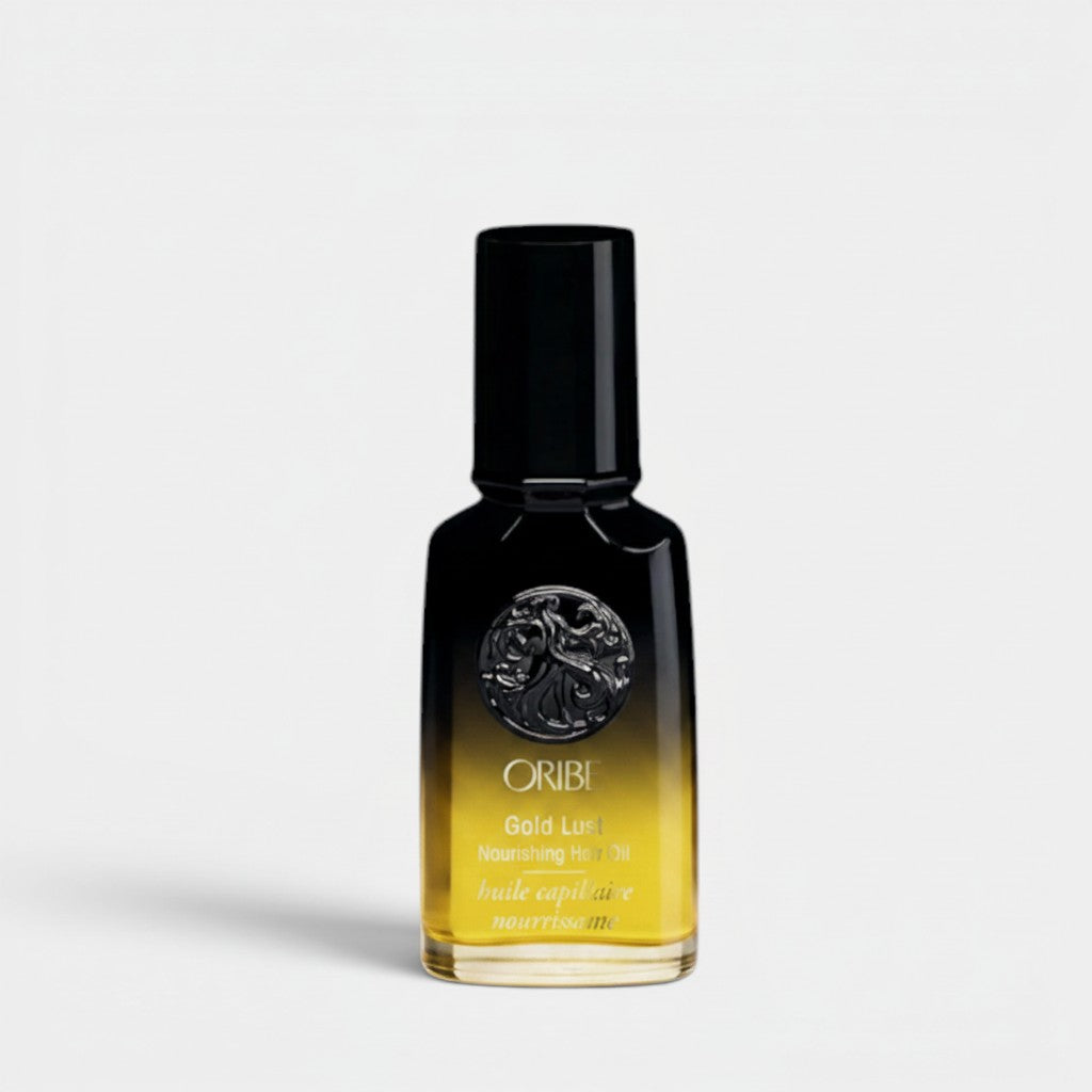 Shop Rescue Spa Oribe Gold Lust Nourishing Hair Oil, a luxurious amber-colored hair oil in a black bottle with gold accents.