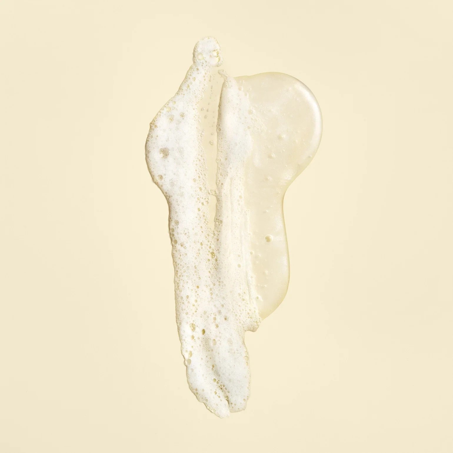 Shop Rescue Spa Oribe Gold Lust Repair and Restore Shampoo texture showing a clear, foaming gel consistency.