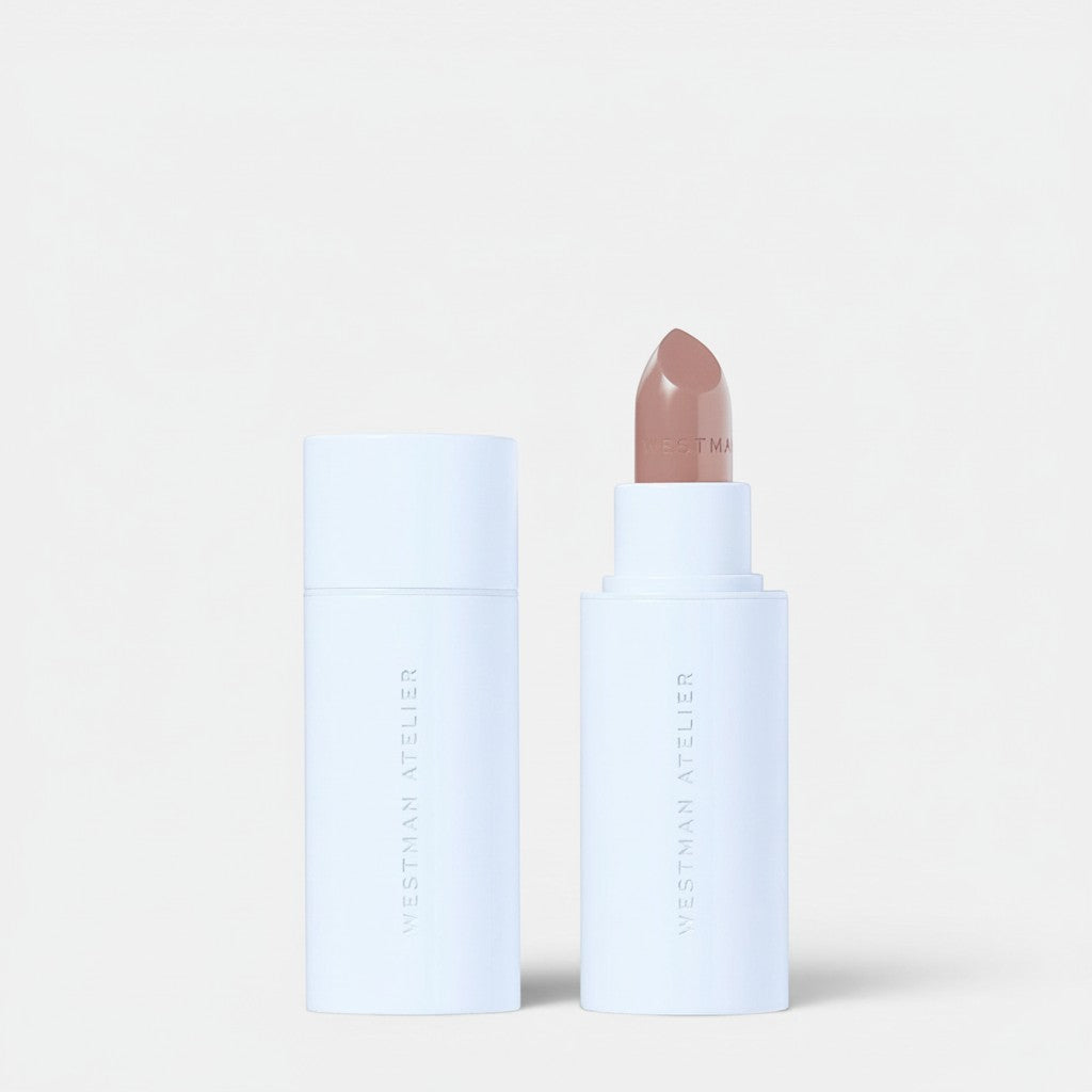 Shop Rescue Spa Hydrobalm Tinted Lipstick in a neutral nude shade, housed in a white tube with a matching cap.