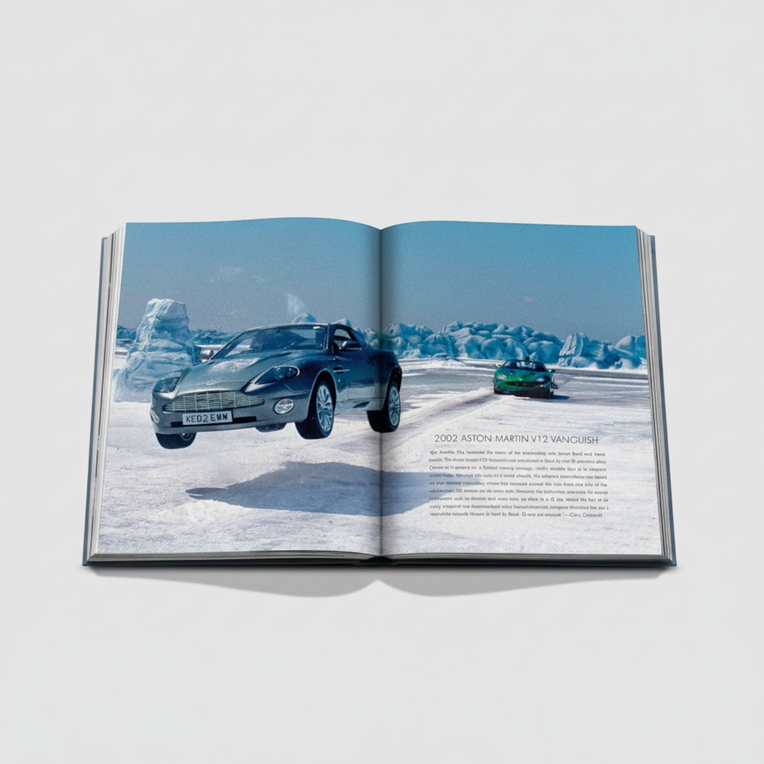 Shop Rescue Spa James Bond Cars book featuring a 2002 Aston Martin V12 Vanquish in a snowy landscape.