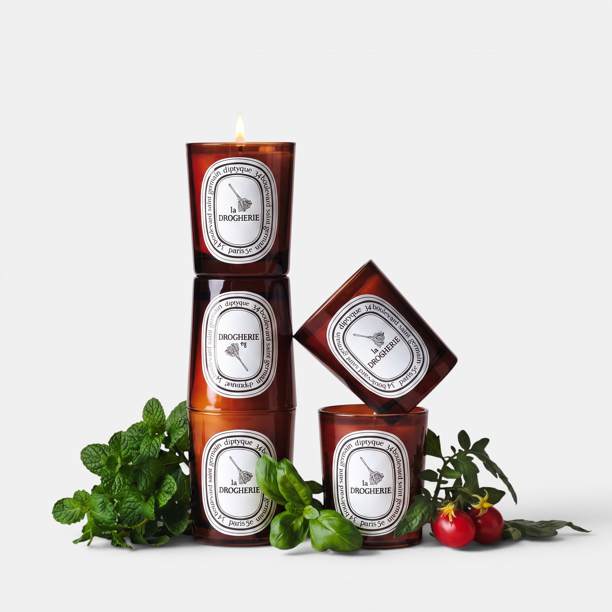 Shop Rescue Spa La Droguerie odor-removing candle in amber glass with basil, mint, and tomato leaf accents