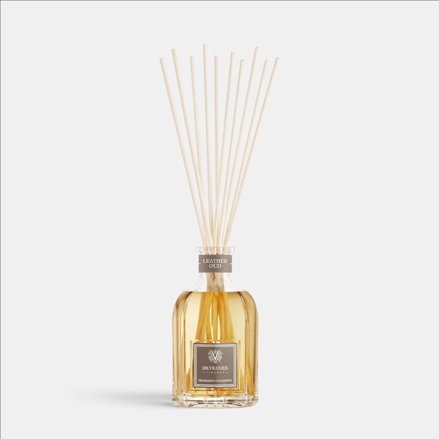Shop Rescue Spa Leather Oud room diffuser in a glass bottle with reed sticks for home fragrance.