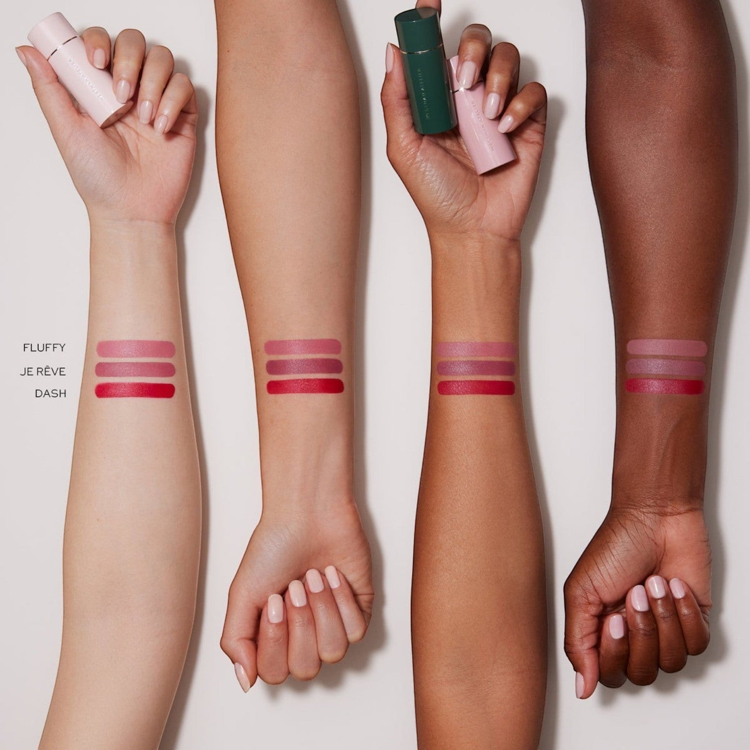 Shop Rescue Spa Lip Suede Matte Lipstick Trio swatches on four different skin tones showing Fluffy, Je Rêve, and Dash.