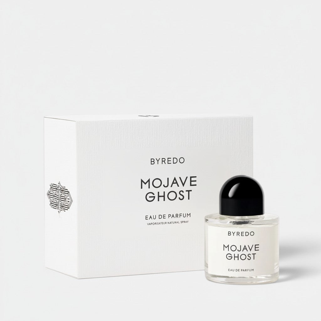 Shop Rescue Spa BYREDO Mojave Ghost Eau De Parfum bottle and box. Woody scent with notes of ambrette, violet, sandalwood, amber, and cedarwood.
