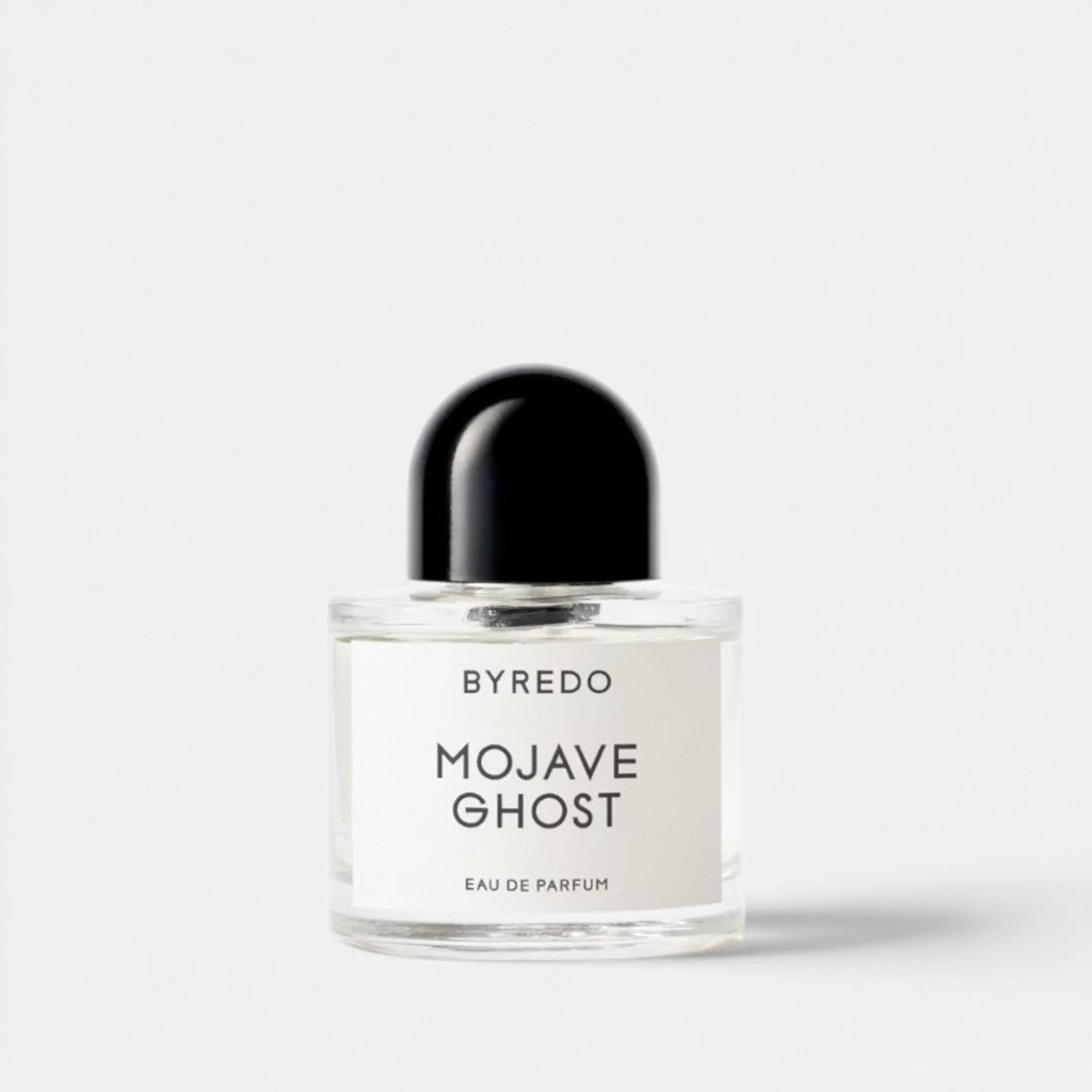 Shop Rescue Spa Byredo Mojave Ghost Eau De Parfum bottle with a black cap. Woody fragrance with notes of Ambrette, Violet, Sandalwood, Amber, and Cedarwood.