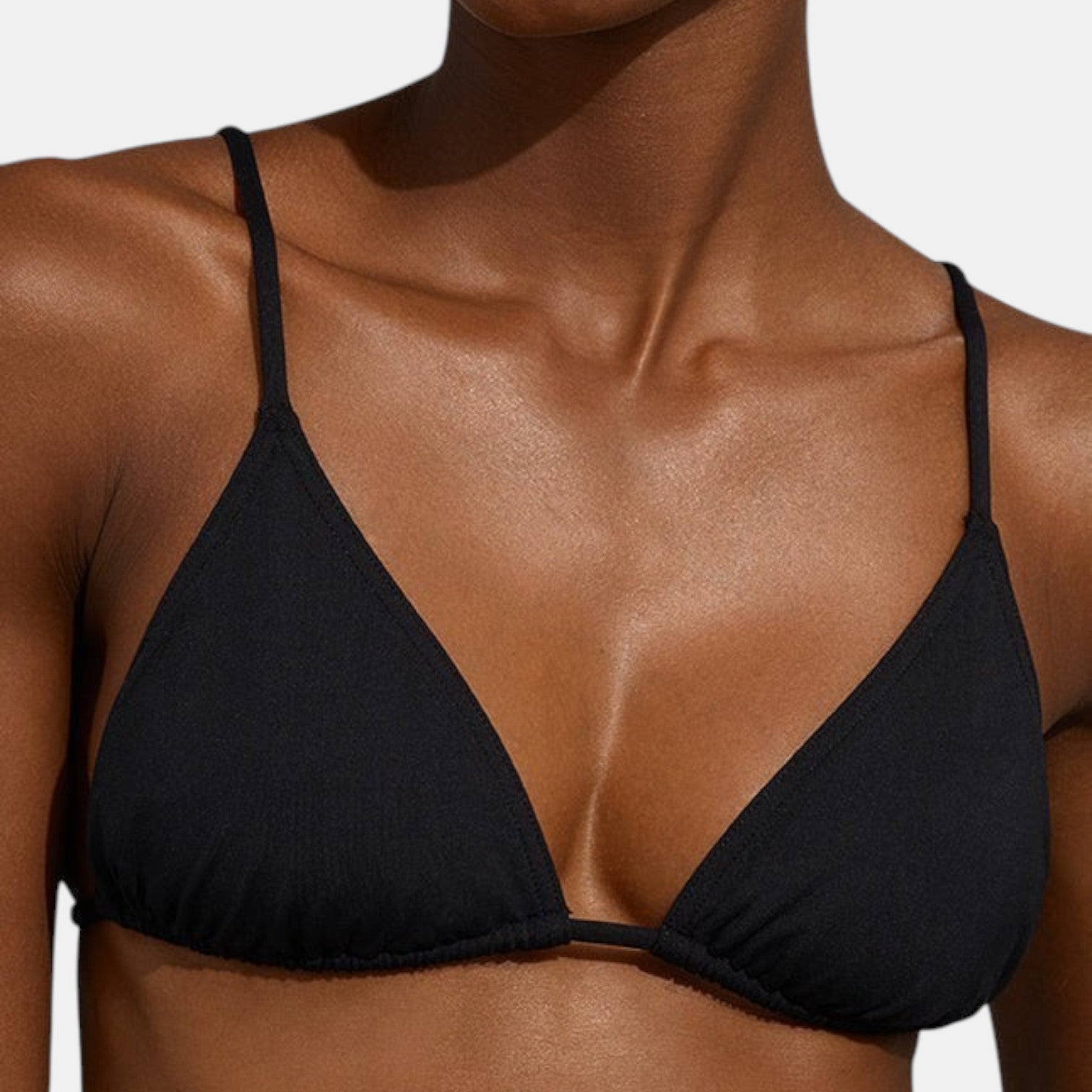 Shop Rescue Spa MOUNA black minimal coverage triangle bikini top with adjustable spaghetti straps on a model