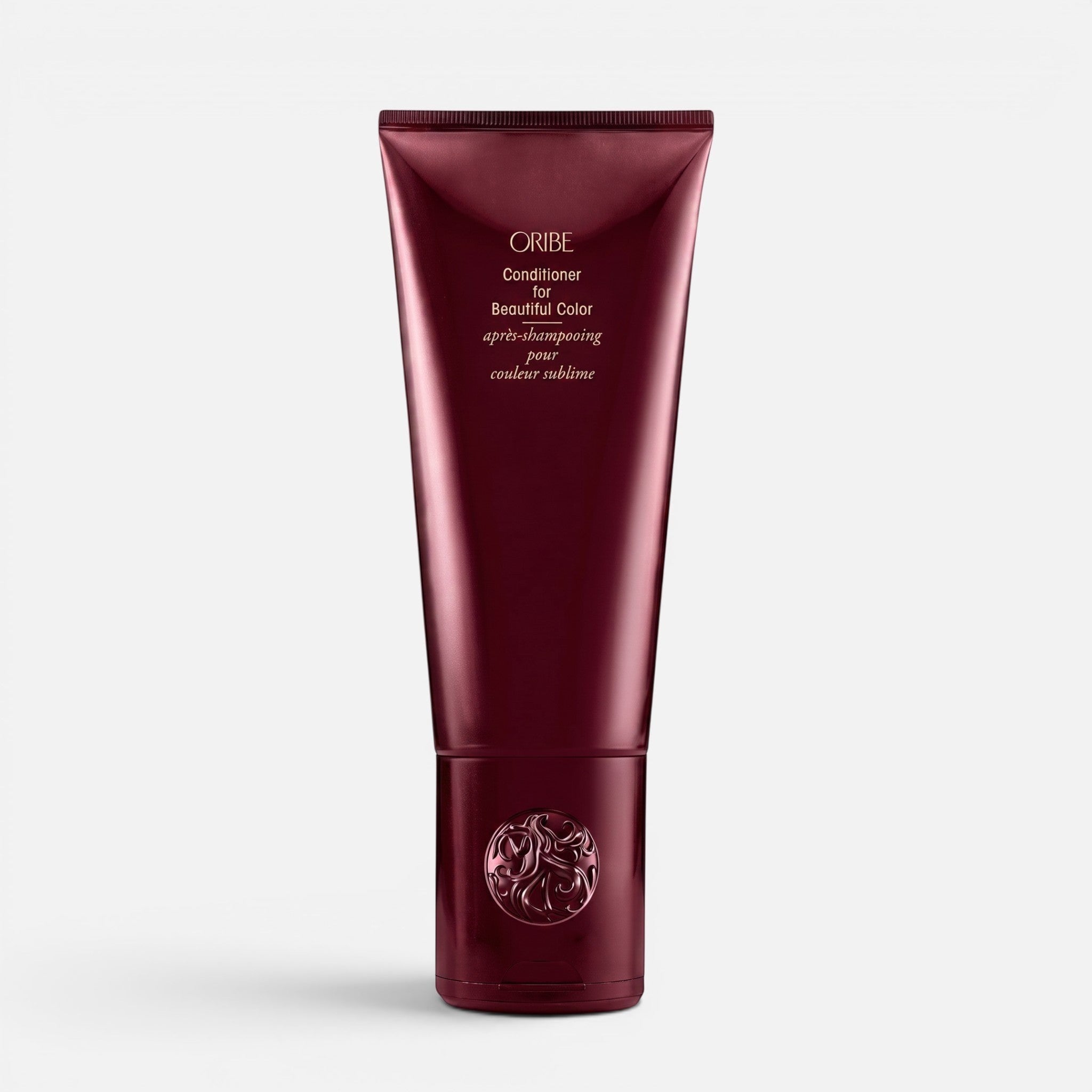 Shop Rescue Spa Oribe Conditioner for Beautiful Color in a deep burgundy squeeze tube for color-treated hair.
