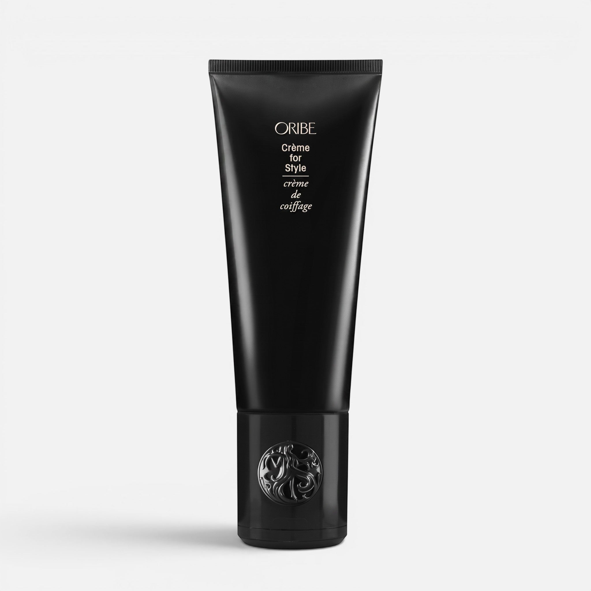 Shop Rescue Spa Oribe Creme for Style hair styling cream in a sleek black squeeze tube with decorative cap.