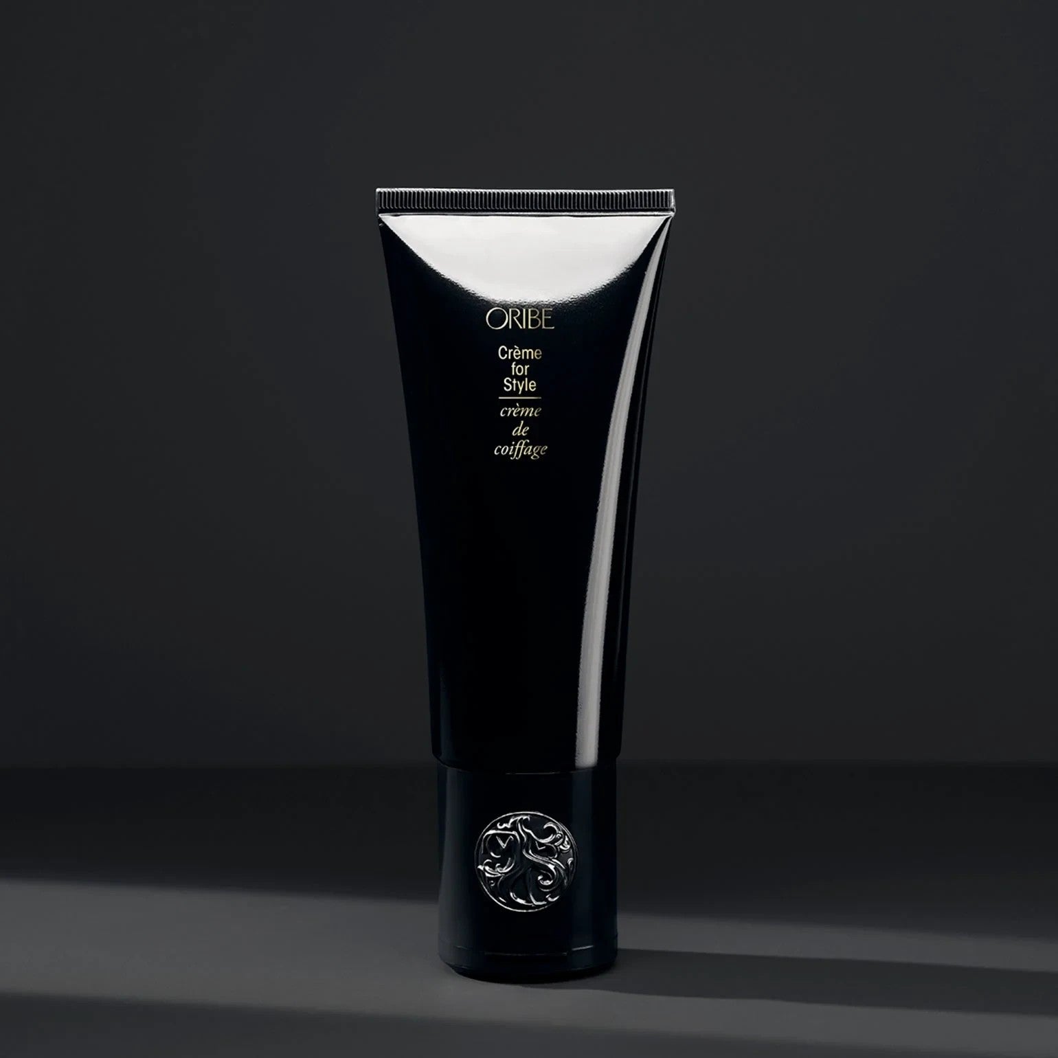 Shop Rescue Spa Oribe Creme for Style hair cream in a sleek black tube with a silver embossed cap.