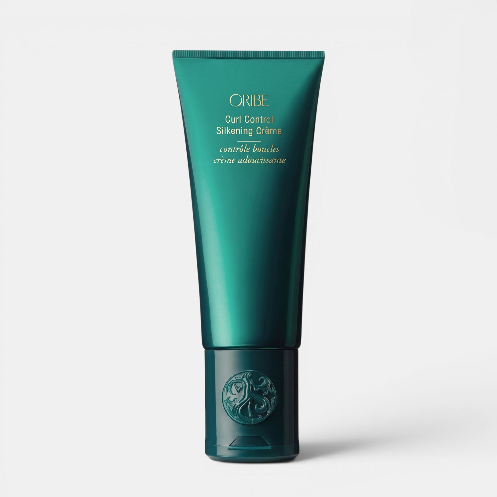 Shop Rescue Spa Oribe Curl Control Silkening Creme in a teal 5 oz squeeze tube for defining and hydrating curls.