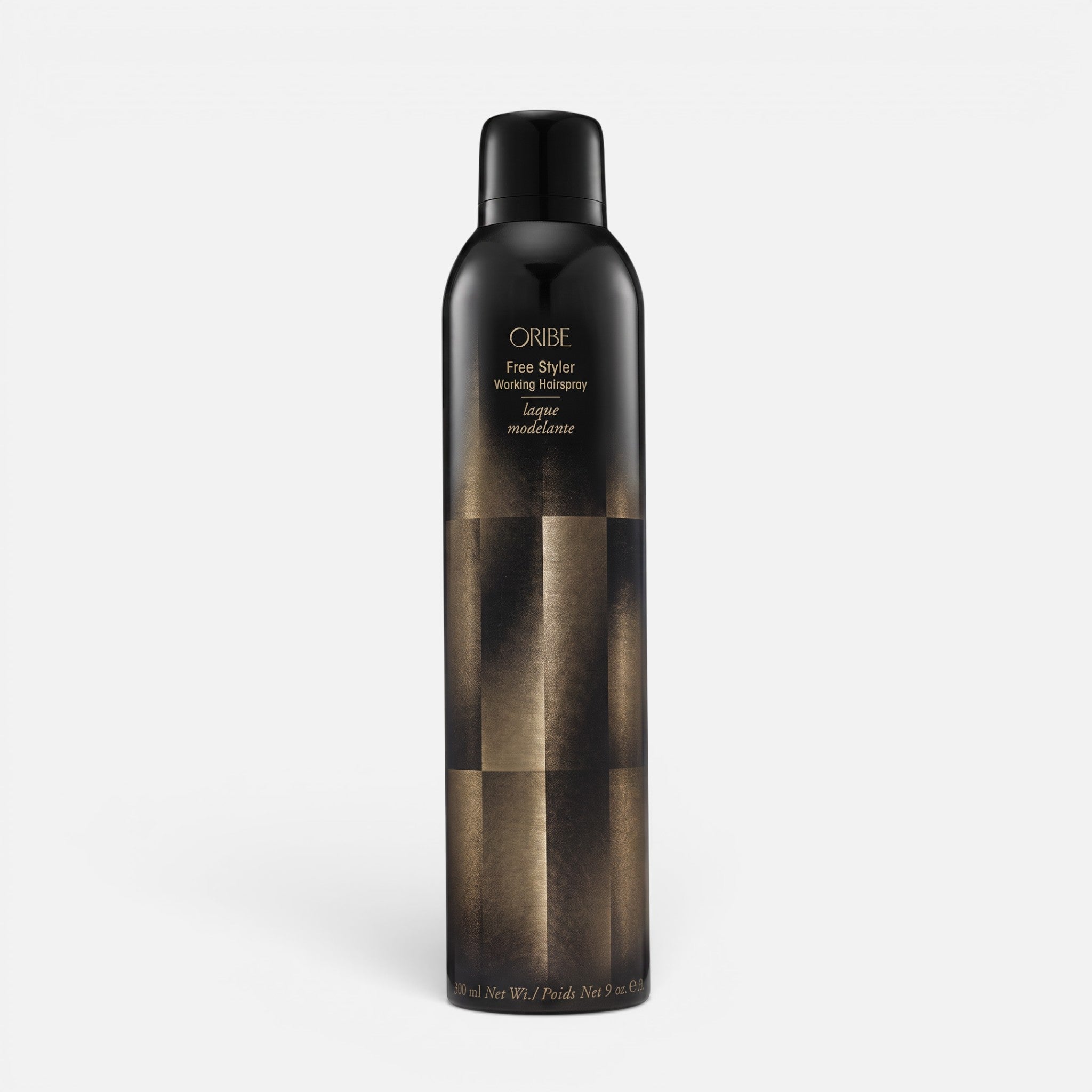Shop Rescue Spa Oribe Free Styler Working Hair Spray in a black and gold 300ml aerosol bottle for light hold styling.