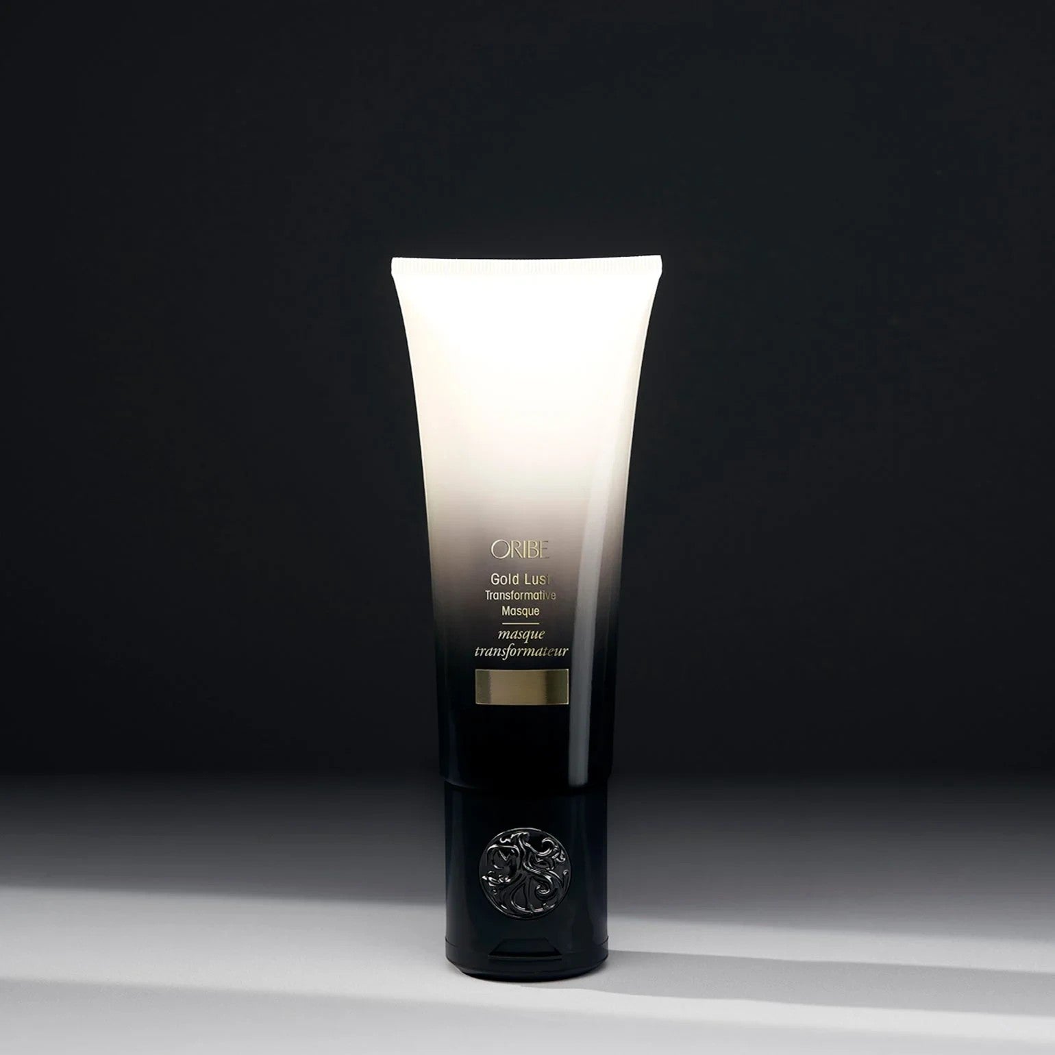 Shop Rescue Spa Oribe Gold Lust Transformative Mask in a sleek black and white gradient tube for hair repair.